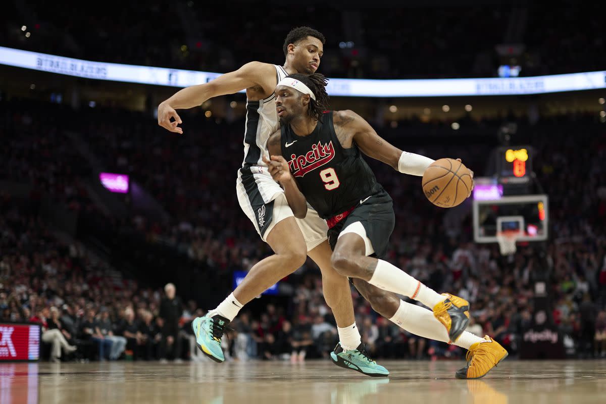 Portland Trail Blazers small forward Jerami Grant drives in against San Antonio Spurs forward Keldon Johnson during the two teams’ second straight matchup against each other in Portland.