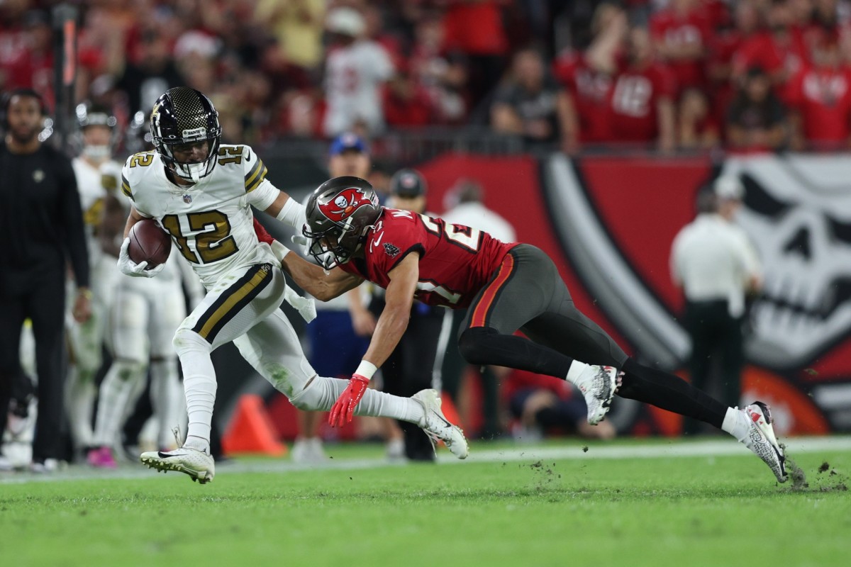 New Orleans Saints wide receiver Chris Olave (12) after a catch against Tampa Bay Buccaneers cornerback Zyon McCollum (27). Mandatory Credit: Nathan Ray Seebeck-USA TODAY Sports