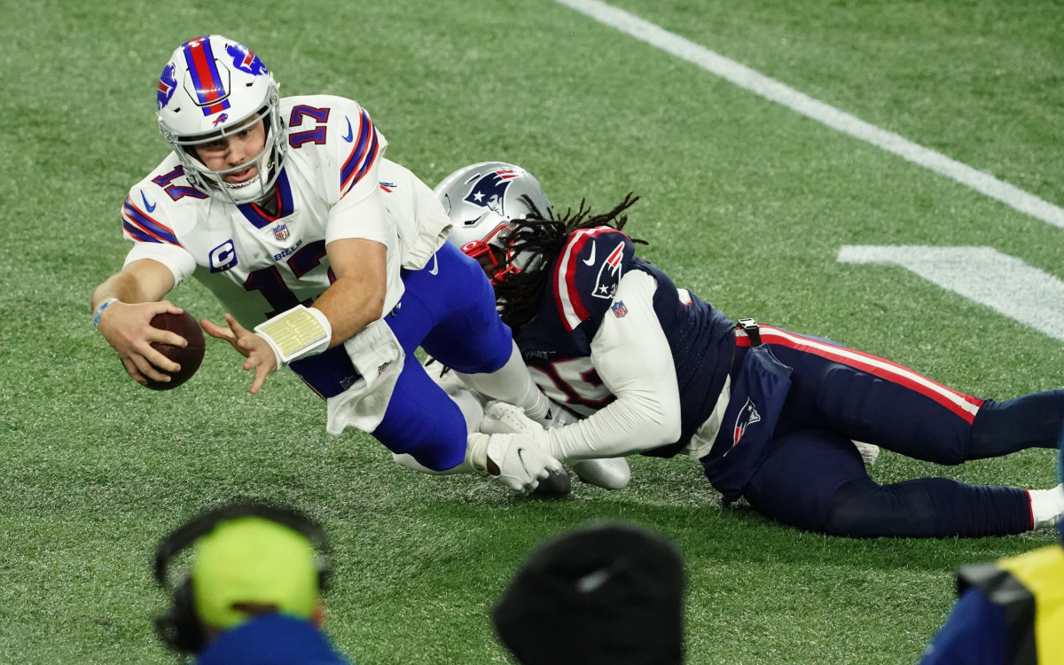 Dec 28, 2020; Foxborough, Massachusetts, USA; Buffalo Bills quarterback Josh Allen (17) runs the ball against New England Patriots defensive back Kyle Dugger (35) in the second half at Gillette Stadium.