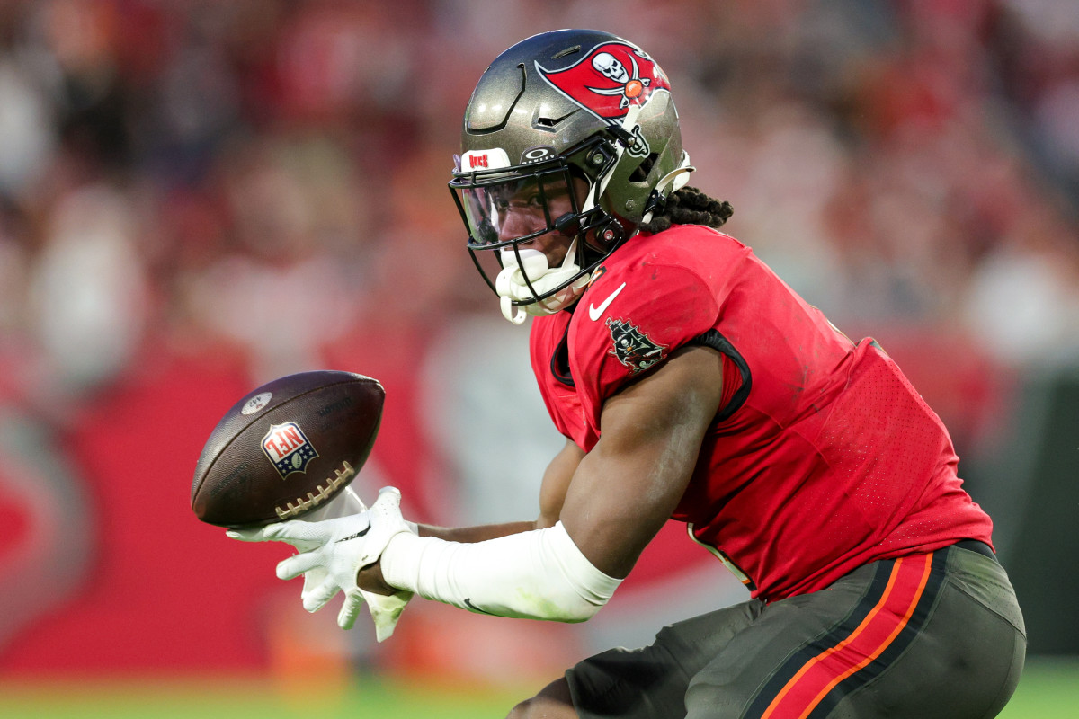 Dec 24, 2023; Tampa, Florida, USA; Tampa Bay Buccaneers running back Rachaad White (1) bobbles a pass against the Jacksonville Jaguars in the third quarter at Raymond James Stadium. Mandatory Credit: Nathan Ray Seebeck-USA TODAY Sports