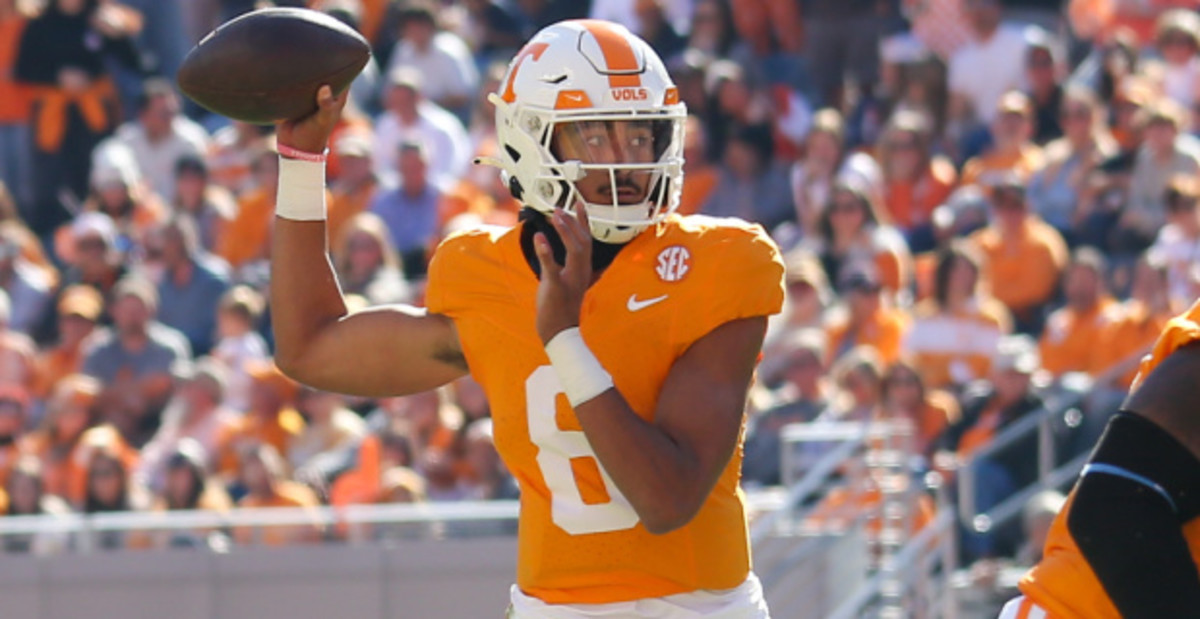 Tennessee Volunteers quarterback Nico Iamaleava attempts a pass during a college football game in the SEC.