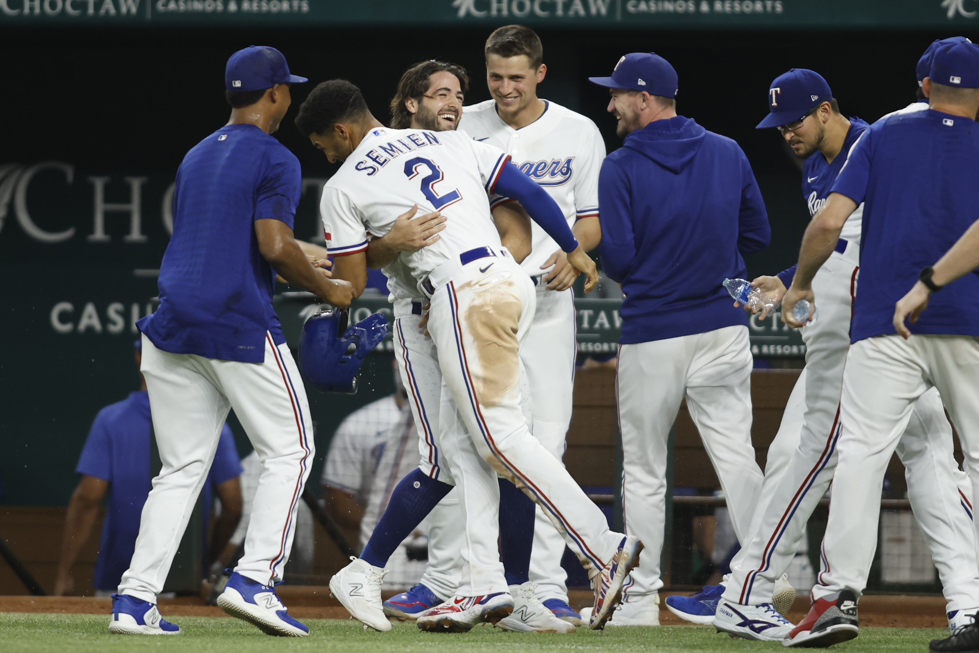 Texas Rangers bench player and pinch-runner Josh Smith celebrates with his teammates after scoring the winning run on a walk-off wild pitch in the ninth inning against the Tampa Bay Rays on July 17 at Globe Life Field.