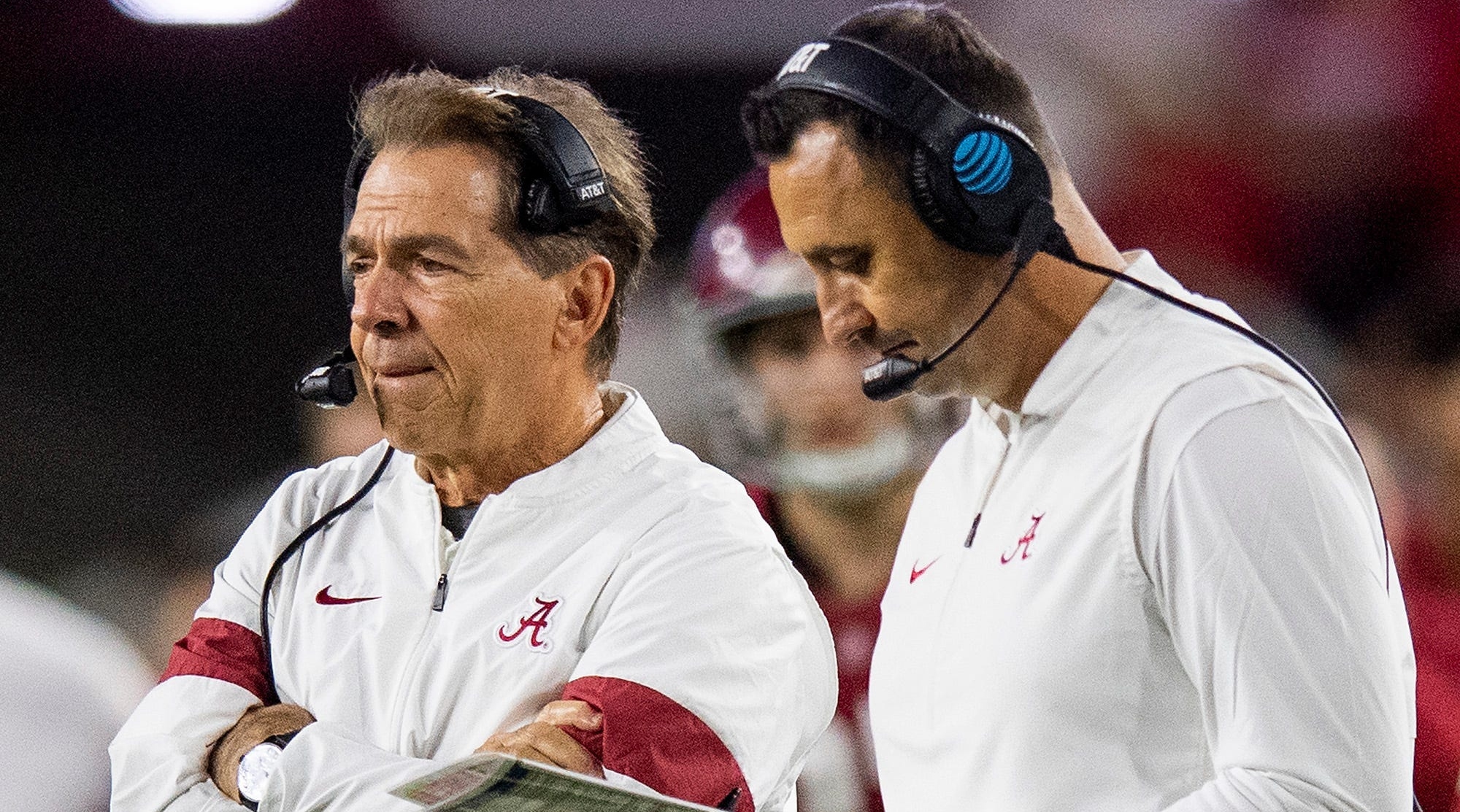 Alabama head coach Nick Saban and then-offensive coordinator Steve Sarkisian confer on the sideline during a game against Arkansas.