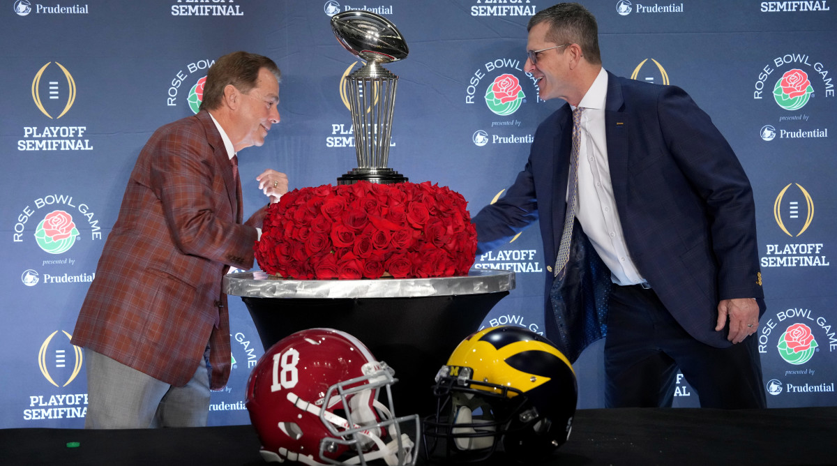 Alabama Crimson Tide head coach Nick Saban and Michigan Wolverines head coach Jim Harbaugh shake hands at the Rose Bowl coaches press conference.
