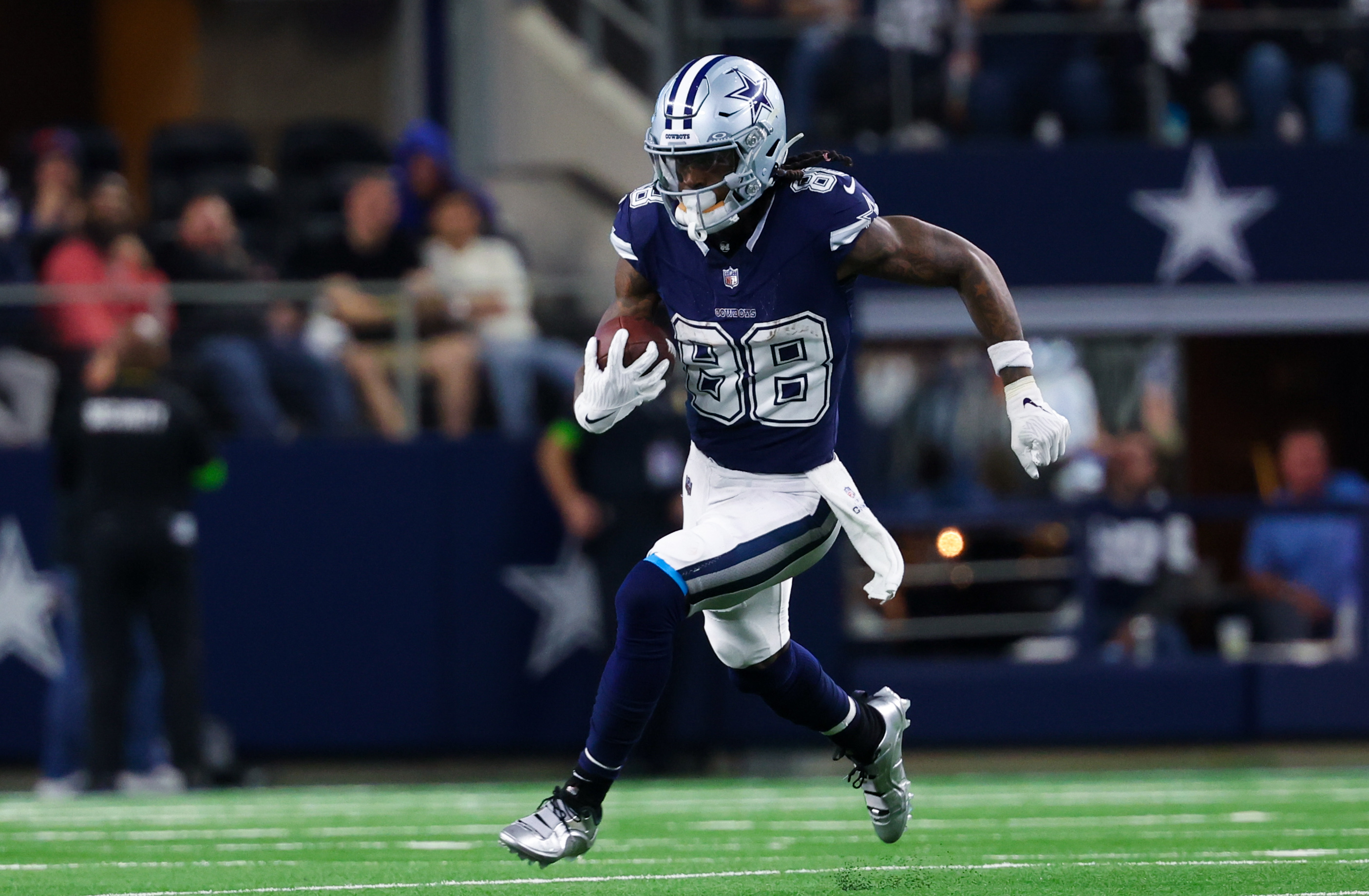 Dec 30, 2023; Arlington, Texas, USA; Dallas Cowboys wide receiver CeeDee Lamb (88) runs with the ball during the second half against the Detroit Lions at AT&T Stadium.