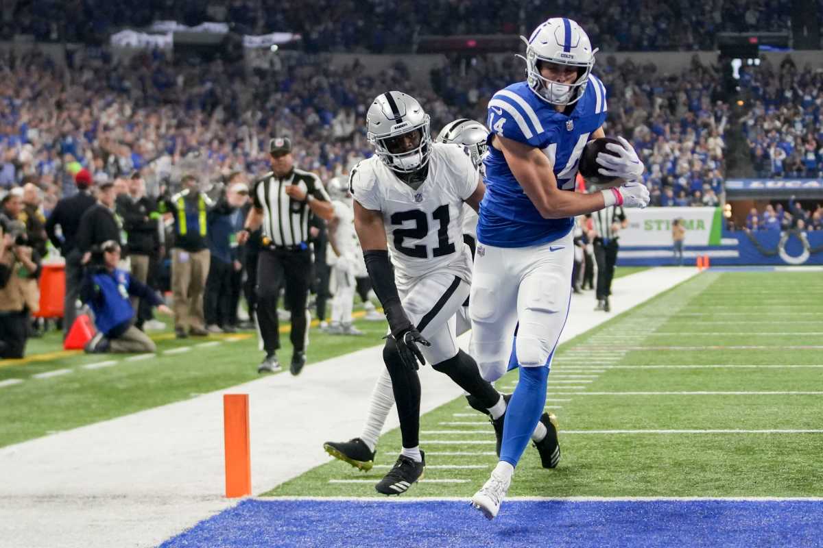 Indianapolis Colts wide receiver Alec Pierce (14) runs into the end zone for a touchdown as Las Vegas Raiders cornerback Amik Robertson (21) gives chase Sunday, Dec. 31, 2023, during a game against the Las Vegas Raiders at Lucas Oil Stadium in Indianapolis.  