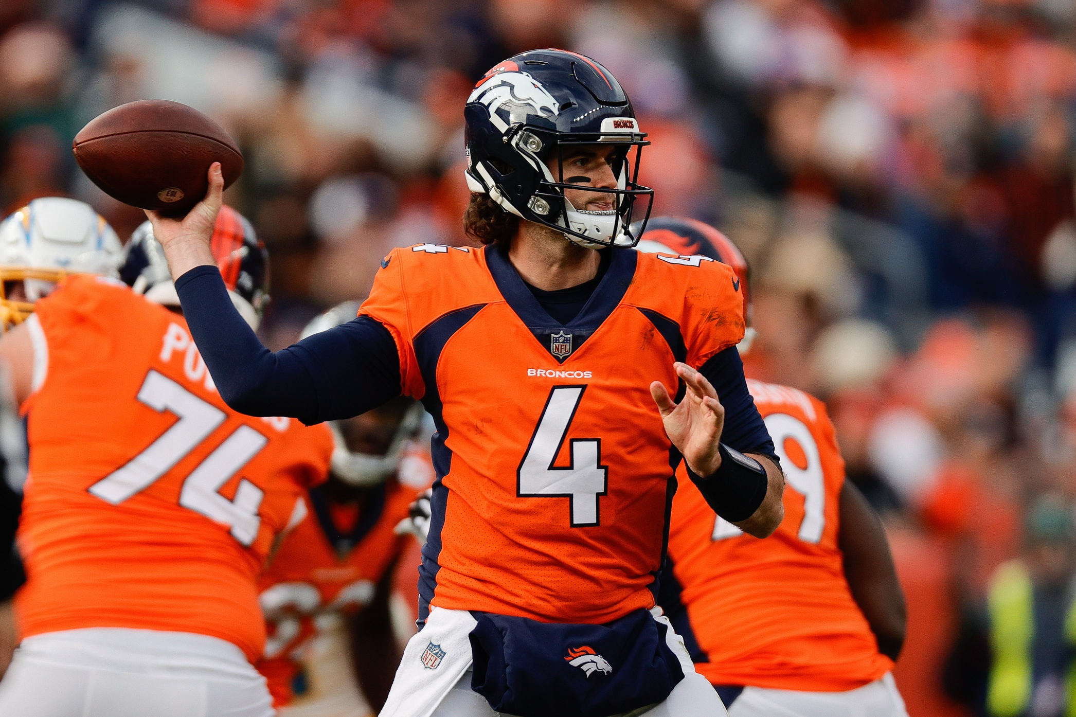 Denver Broncos quarterback Jarrett Stidham (4) attempts a pass in the first quarter against the Los Angeles Chargers at Empower Field at Mile High.