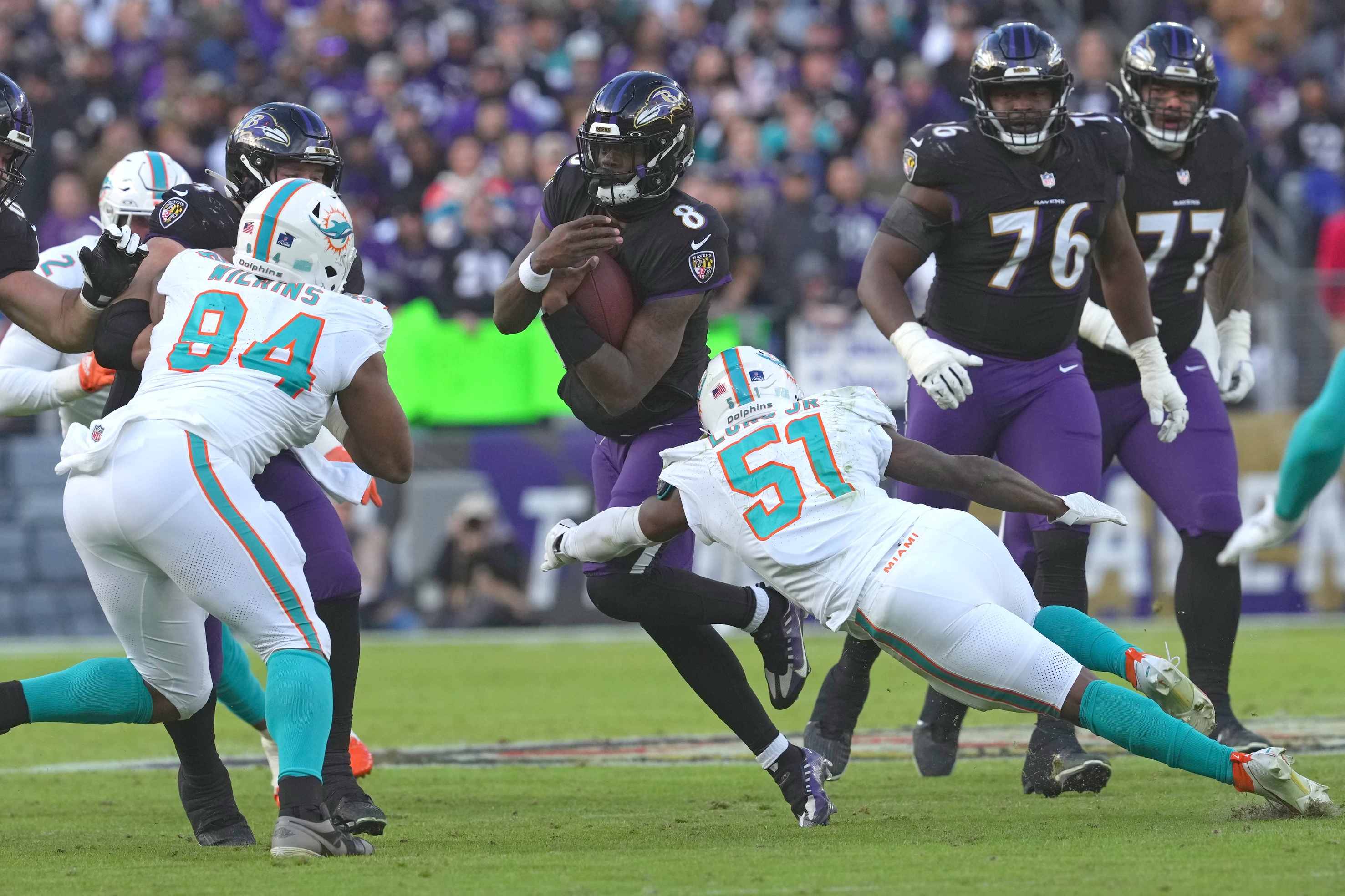Ravens quarterback Lamar Jackson is more than a running quarterback, averaging his fewest rushing attempts in his career in 2023.