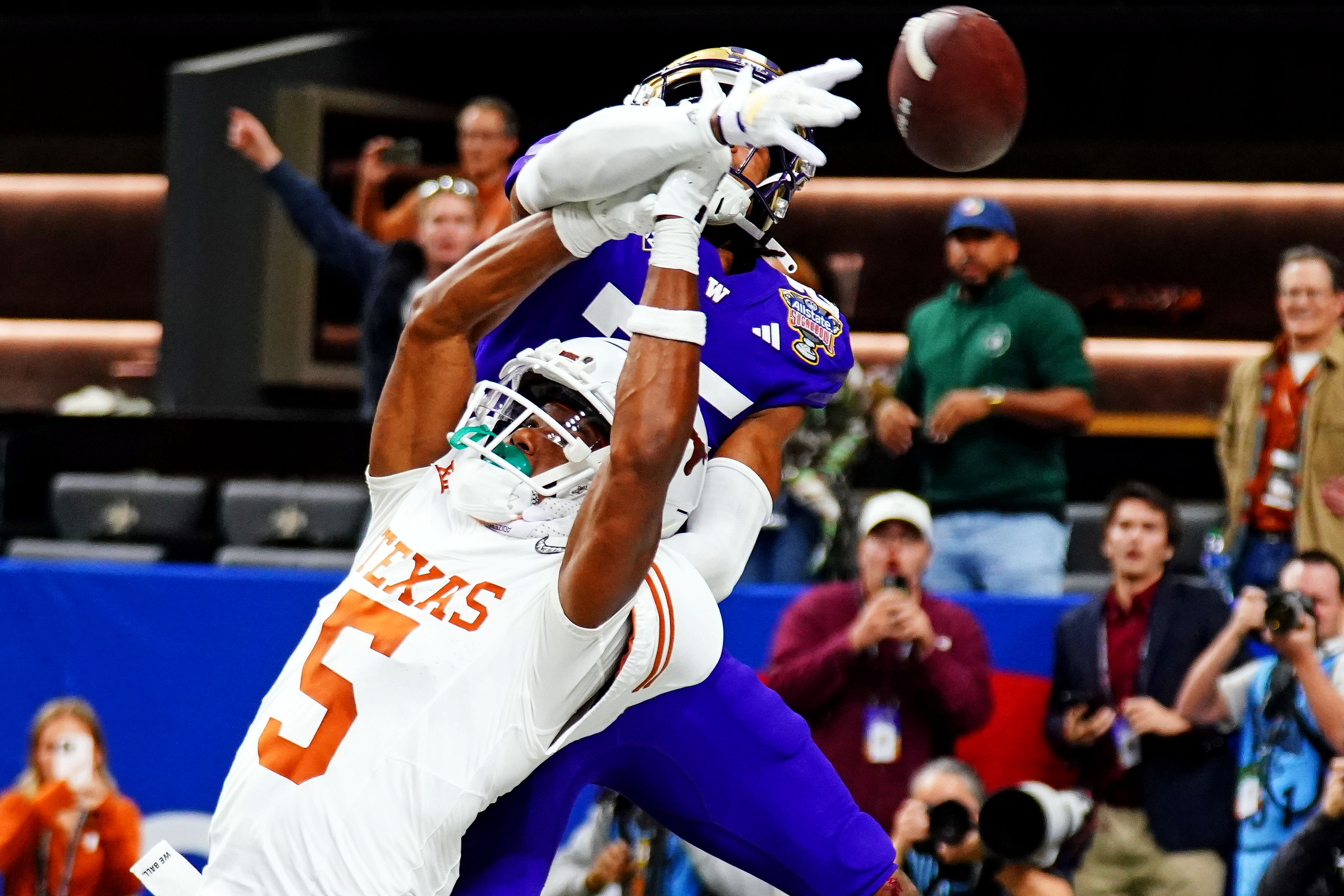 Texas Longhorns Adonai Mitchell misses a catch against Washington in the 2024 College Football Playoff semifinal in the Sugar Bowl 