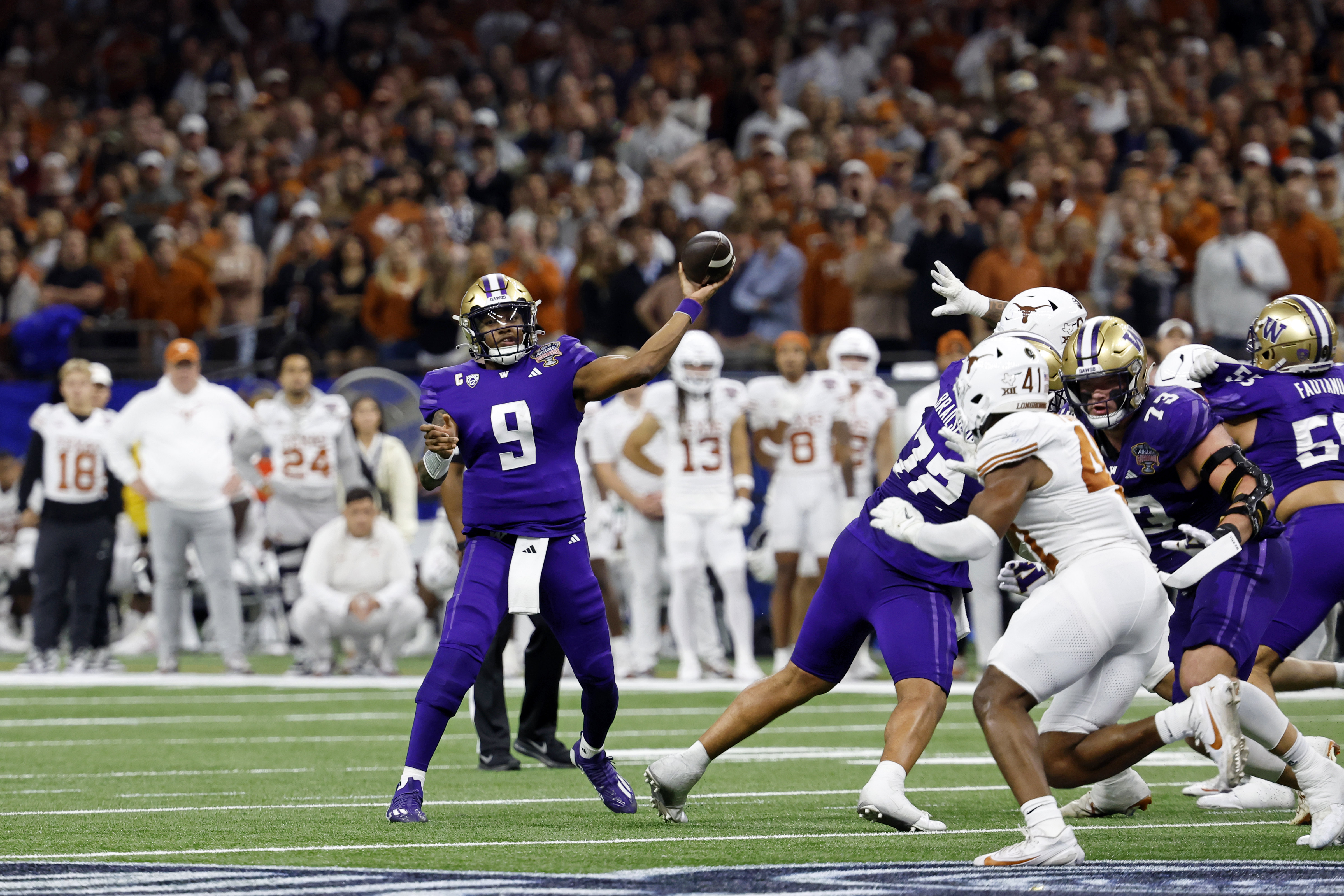 Jan 1, 2024; New Orleans, LA, USA; Washington Huskies quarterback Michael Penix Jr. (9) passes the ball against the Texas Longhorns during the second half of the 2024 Sugar Bowl college football playoff semifinal game at Caesars Superdome.