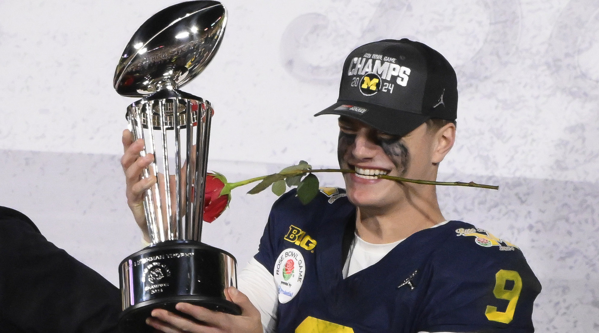 Michigan Wolverines quarterback J.J. McCarthy (9) hold the Rose Bowl trophy after the wolverines defeated the Alabama Crimson Tide in the 2024 Rose Bowl college football playoff semifinal game at Rose Bowl. 