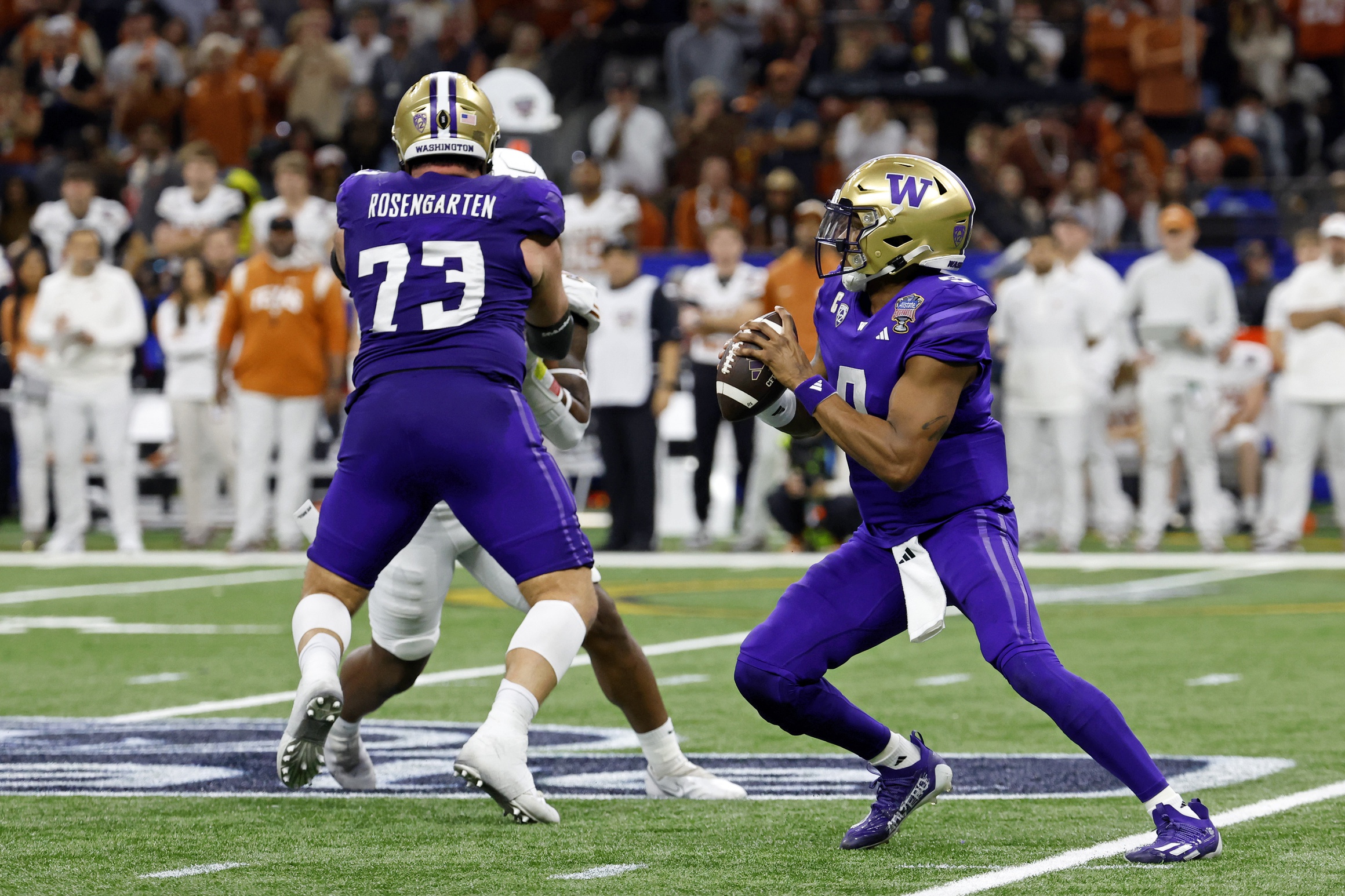 Jan 1, 2024; New Orleans, LA, USA; Washington Huskies quarterback Michael Penix Jr. (9) looks to pass the ball against the Texas Longhorns during the second half of the 2024 Sugar Bowl college football playoff semifinal game at Caesars Superdome.