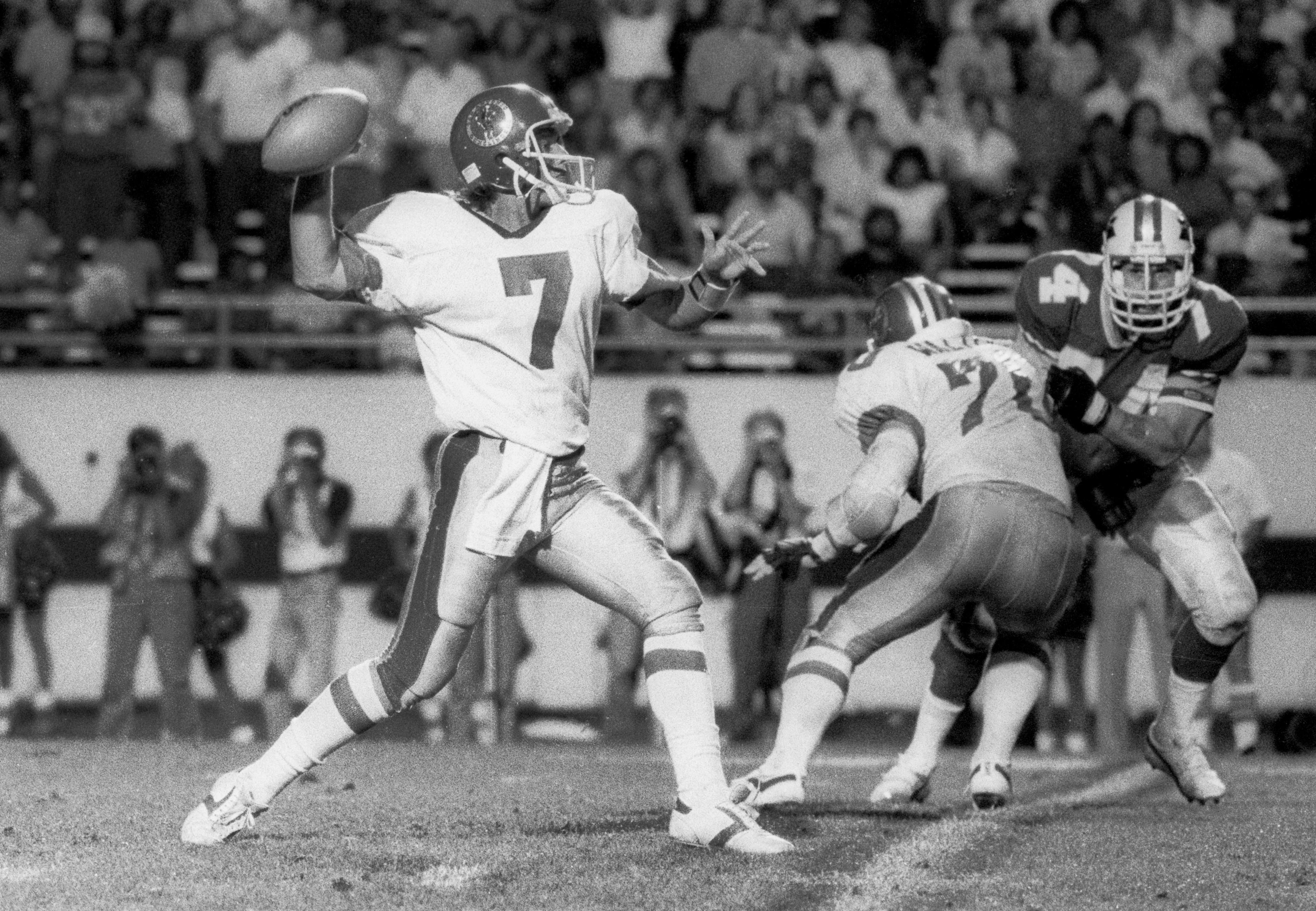 May 13, 1985; Orlando, FL, USA: FILE PHOTO; San Antonio Gunslingers quarterback Rick Neuheisel (7) in action against the Orlando Renegades at the Citrus Bowl during the 1985 USFL season. Mandatory Credit: USA TODAY Sports