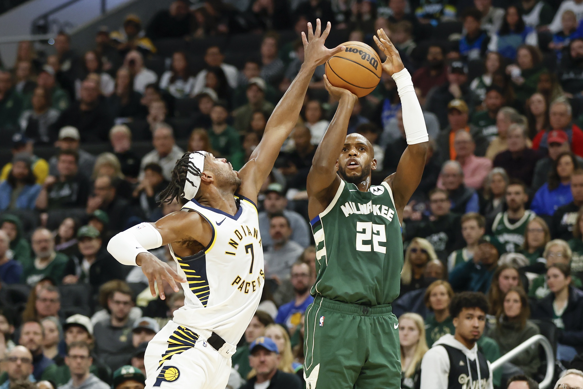 Milwaukee Bucks forward Khris Middleton (22) shoots against Indiana Pacers guard Buddy Hield (7)