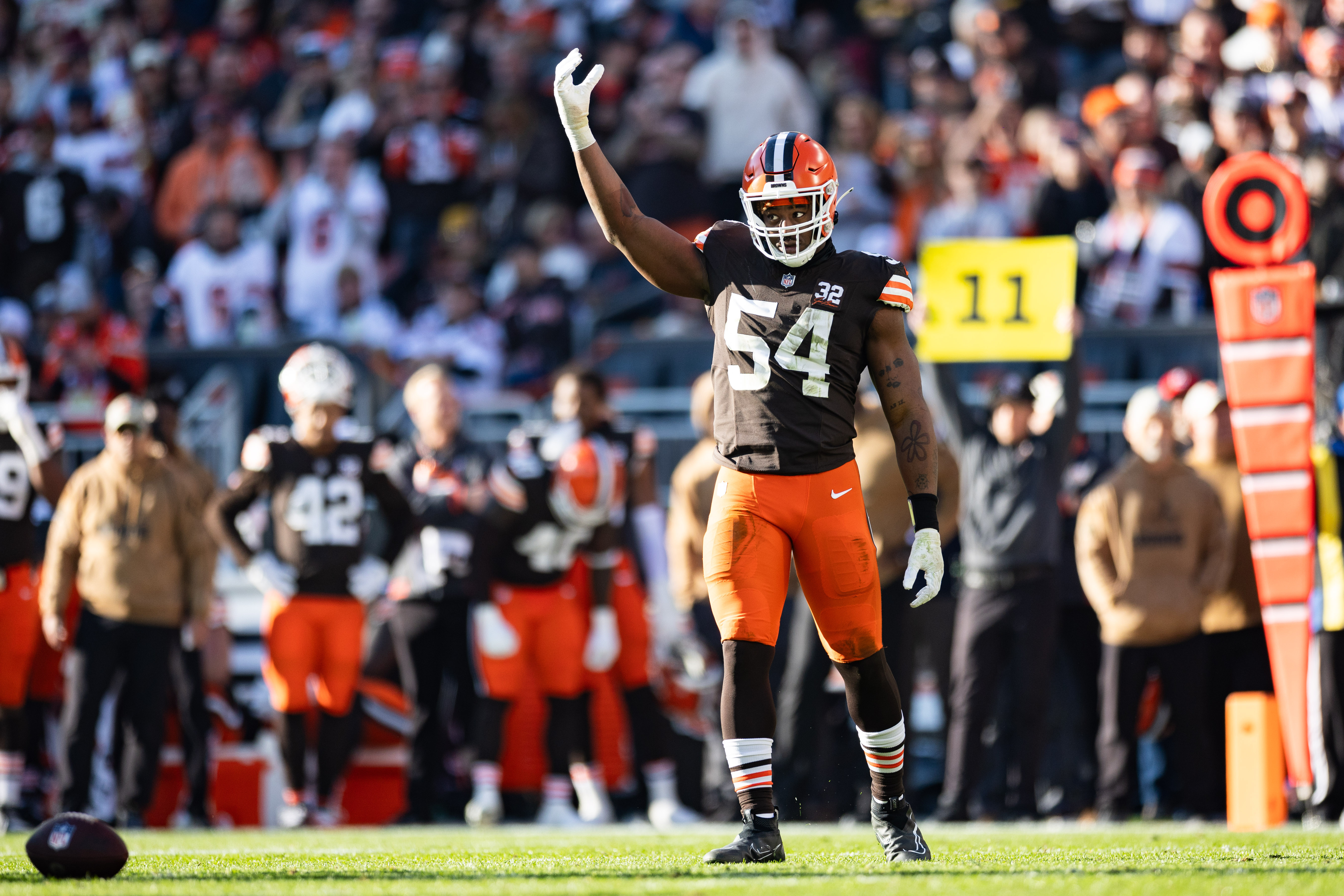 Nov 19, 2023; Cleveland, Ohio, USA; Cleveland Browns defensive end Ogbo Okoronkwo (54) raises his arm to pump up the crowd against the Pittsburgh Steelers during the third quarter at Cleveland Browns Stadium.