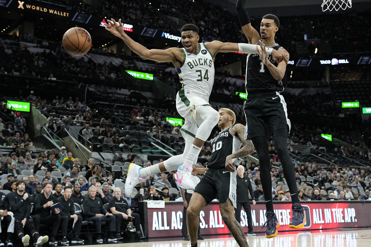 Jan 4, 2024; San Antonio, Texas, USA; Milwaukee Bucks forward Giannis Antetokounmpo (34) loses control of the ball while driving to the basket against San Antonio Spurs forward Victor Wembanyama (1) during the first half at Frost Bank Center.