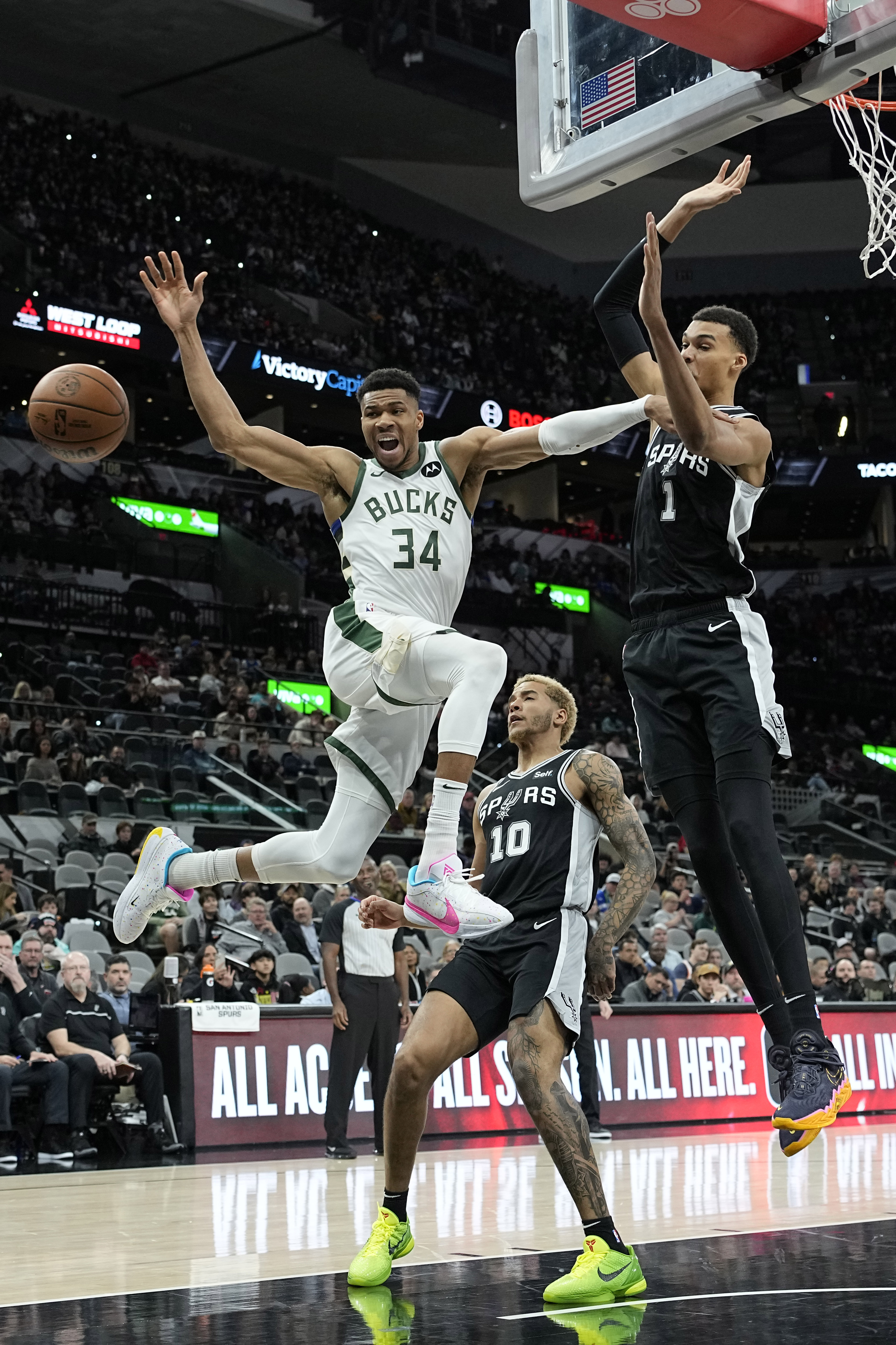 Jan 4, 2024; San Antonio, Texas, USA; Milwaukee Bucks forward Giannis Antetokounmpo (34) loses control of the ball while driving to the basket against San Antonio Spurs forward Victor Wembanyama (1) during the first half at Frost Bank Center.