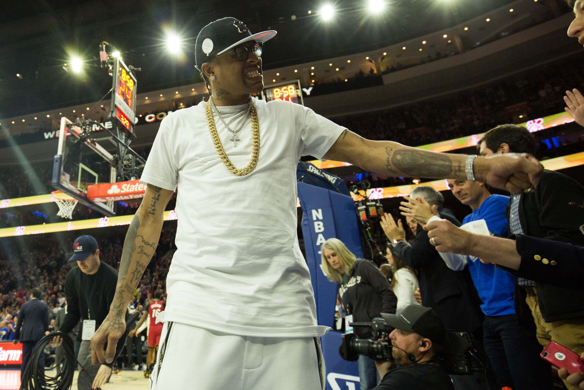 NBA Hall of Fame member and former Philadelphia 76ers Allen Iverson cheers on with fans in game two of the first round of the 2018 NBA Playoffs against the Miami Heat at Wells Fargo Center.