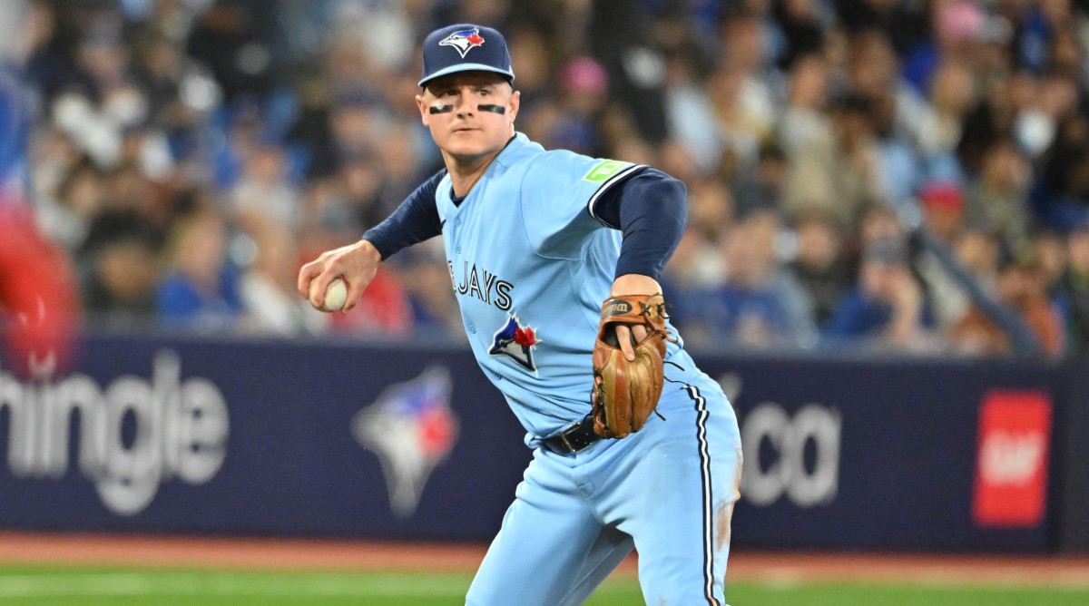 Toronto Blue Jays third baseman Matt Chapman (26) prepares to throw out Texas Rangers designated hitter Mitch Garver.