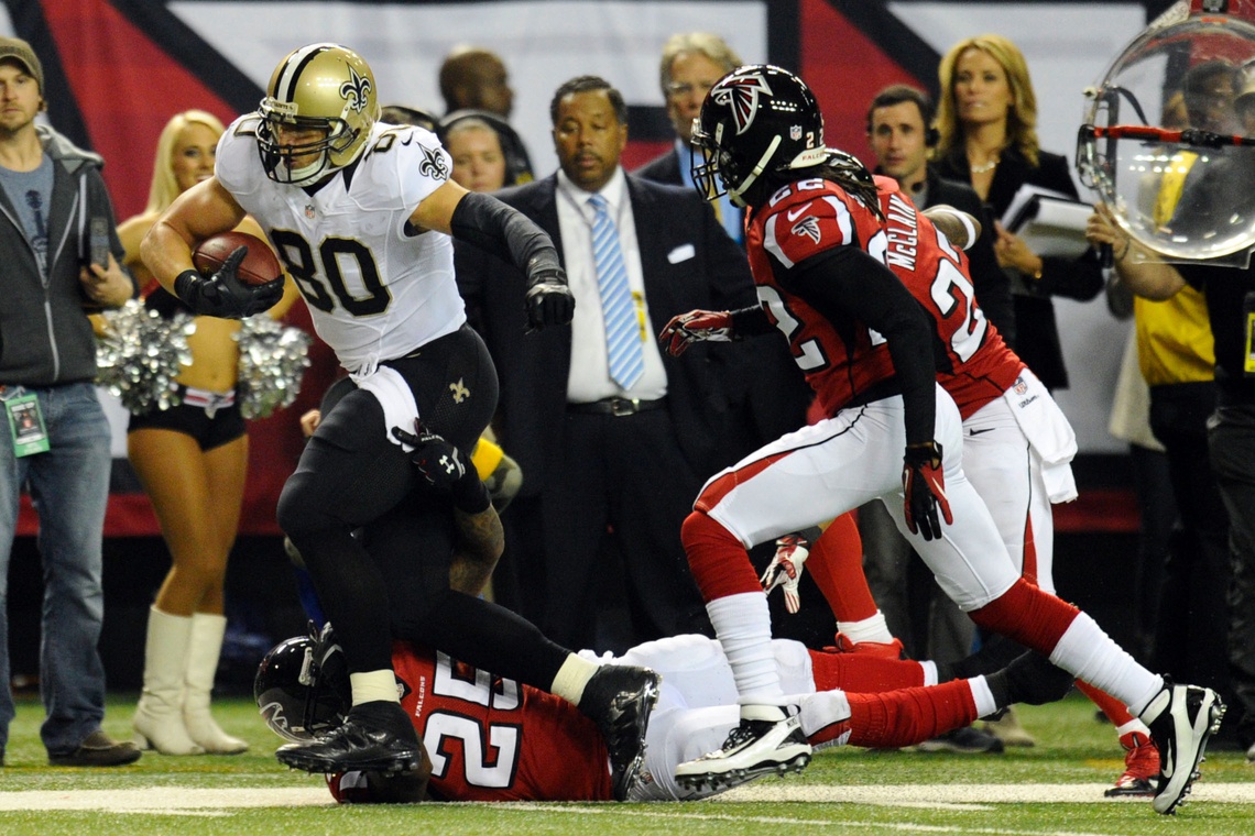 Nov 21, 2013; New Orleans Saints tight end Jimmy Graham (80) breaks a tackle by Atlanta Falcons safety William Moore (25). Mandatory Credit: Dale Zanine-USA TODAY Sports