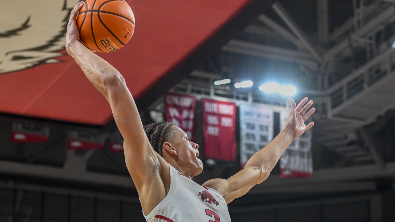 Arkansas Razorbacks' Trevon Brazile goes up for a one-handed dunk in the first half against the Auburn Tigers on Saturday at Bud Walton Arena in Fayetteville, Ark.