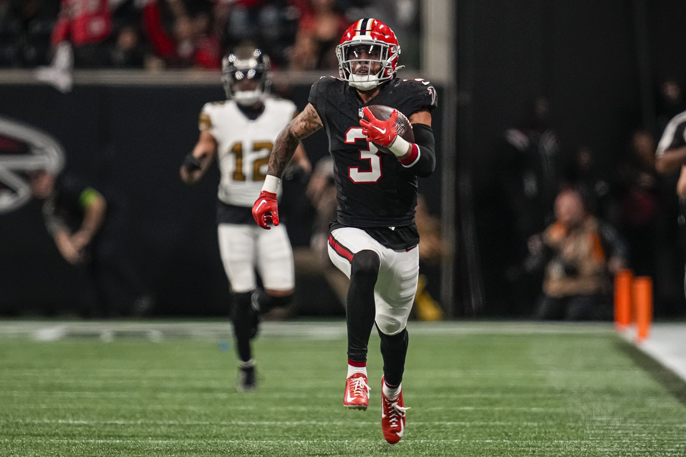 Atlanta Falcons safety Jessie Bates III (3) runs for a touchdown after intercepting a pass against the New Orleans Saints. Mandatory Credit: Dale Zanine-USA TODAY