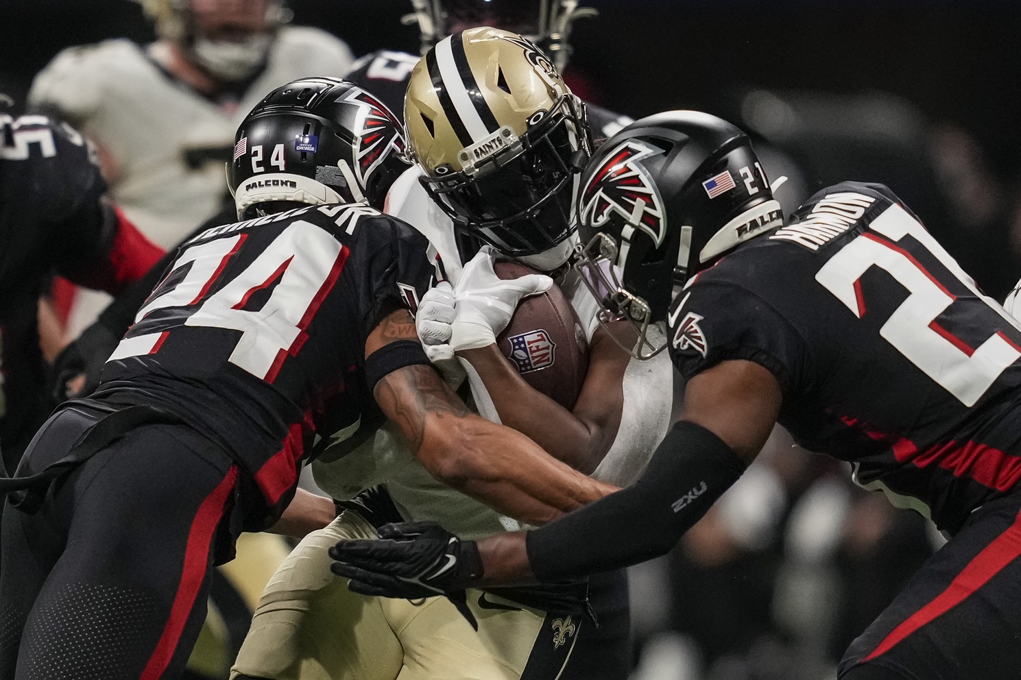 New Orleans Saints running back Alvin Kamara (41) is tackled by Atlanta Falcons cornerback A.J. Terrell (24) and safety Richie Grant (27). Mandatory Credit: Dale Zanine-USA TODAY