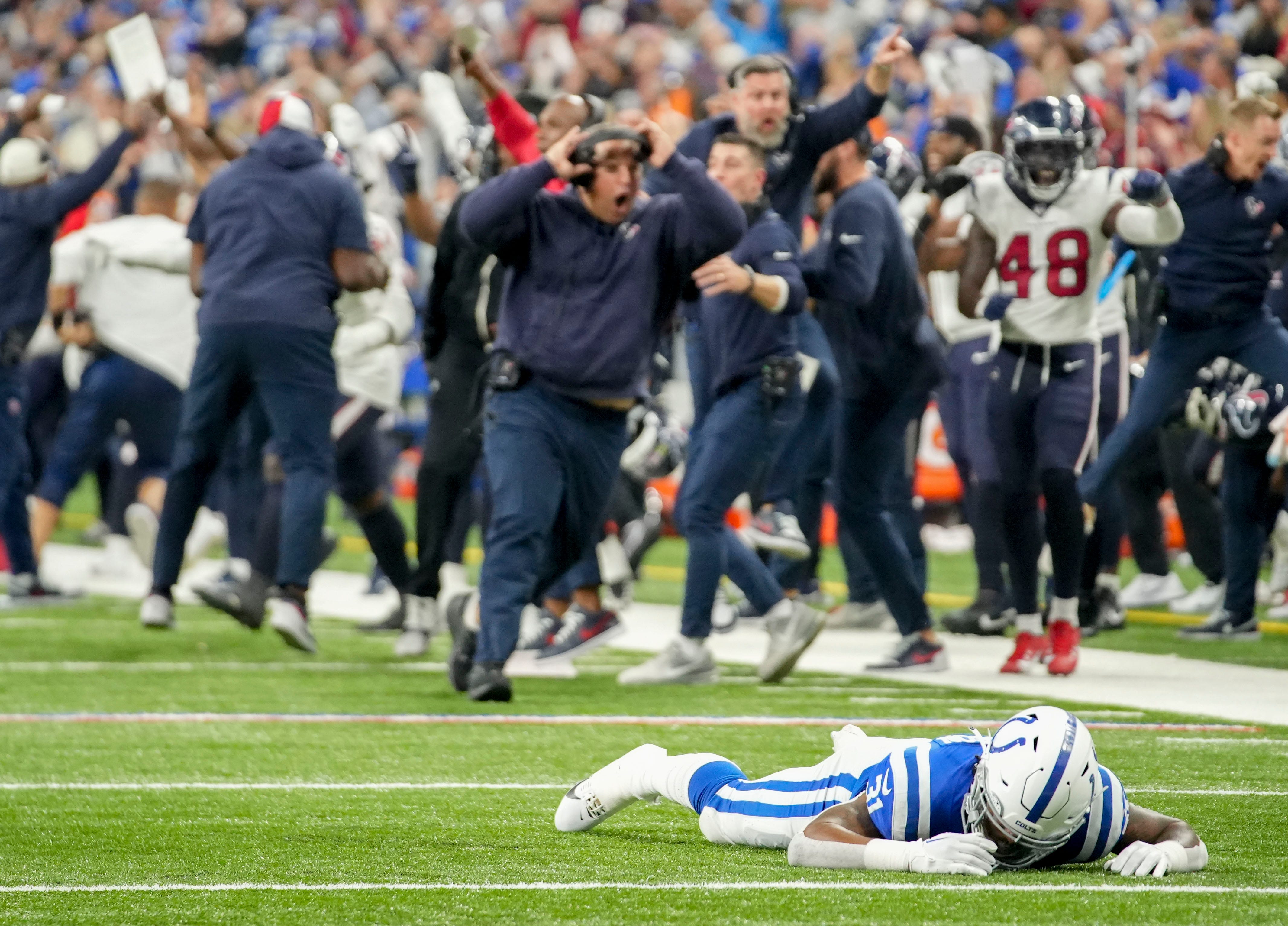 Indianapolis Colts running back Tyler Goodson (31) lies on the turf after missing a catch on fourth down Saturday, Jan. 6, 2024, during a game against the Houston Texans at Lucas Oil Stadium in Indianapolis.  