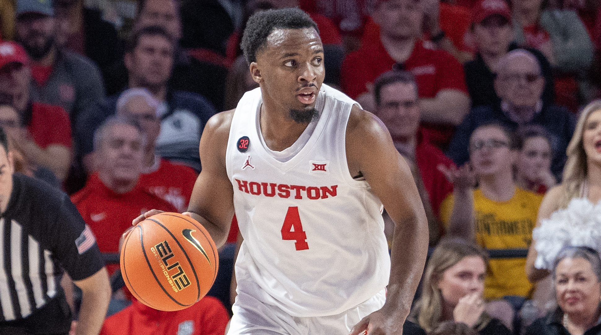 Houston guard L.J. Cryer dribbles against West Virginia