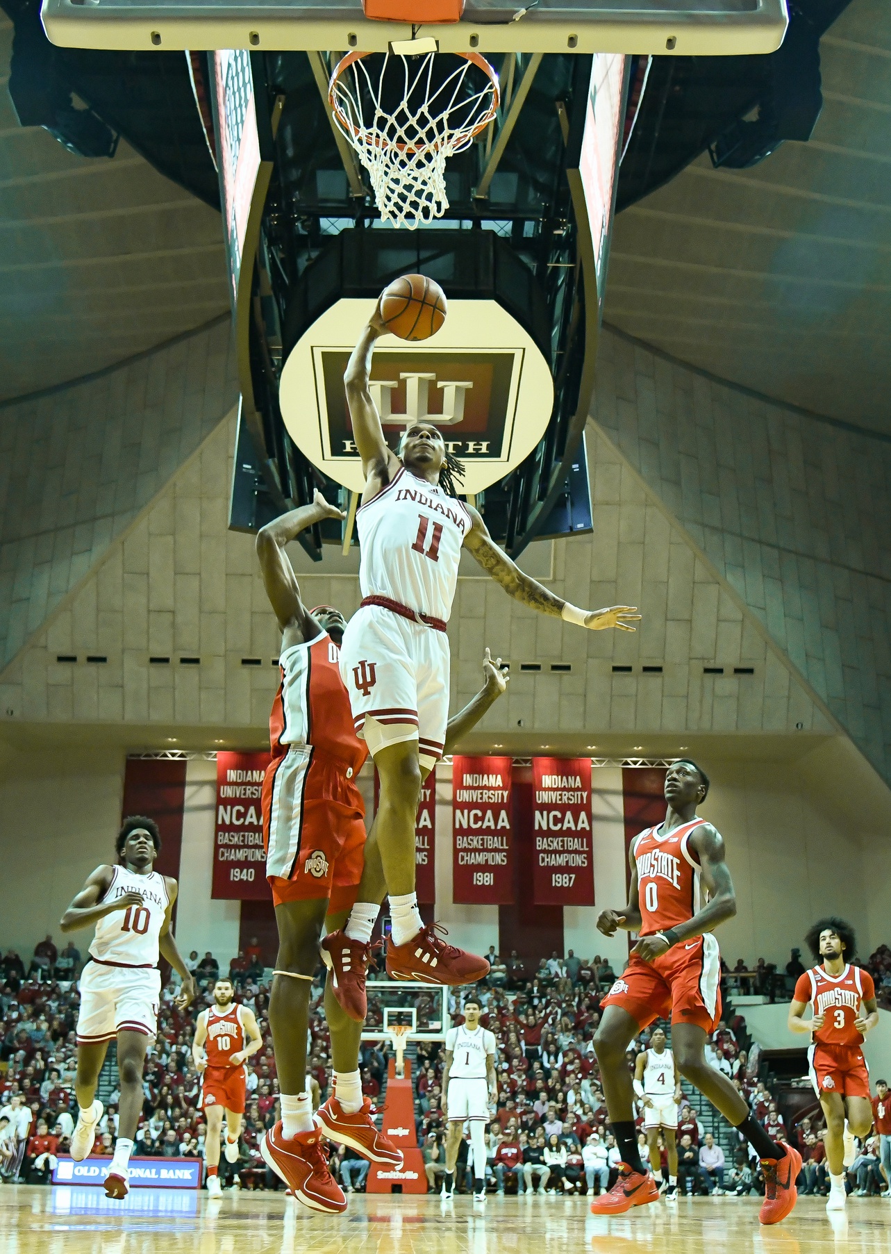 Indiana Hoosiers guard CJ Gunn (11) dunks the ball against Ohio State Buckeyes center Felix Okpara (34) during the first half at Simon Skjodt Assembly Hall.