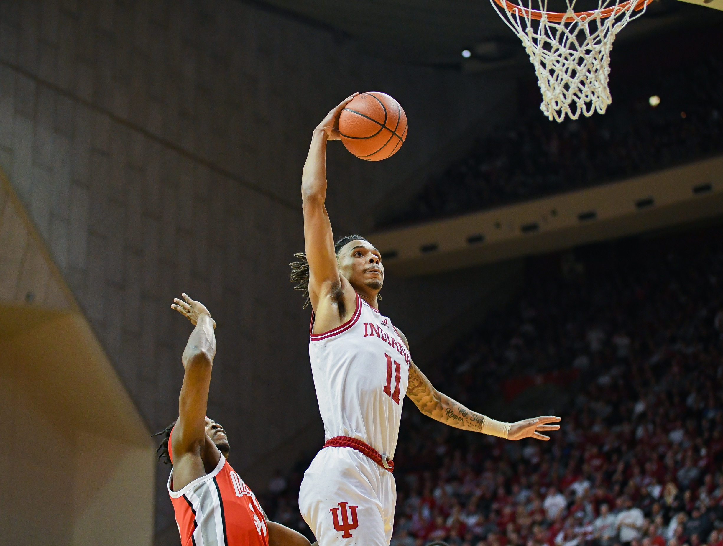 Indiana Hoosiers guard CJ Gunn (11) goes up for a dunk past Ohio State Buckeyes center Felix Okpara (34) during the first half at Simon Skjodt Assembly Hall.