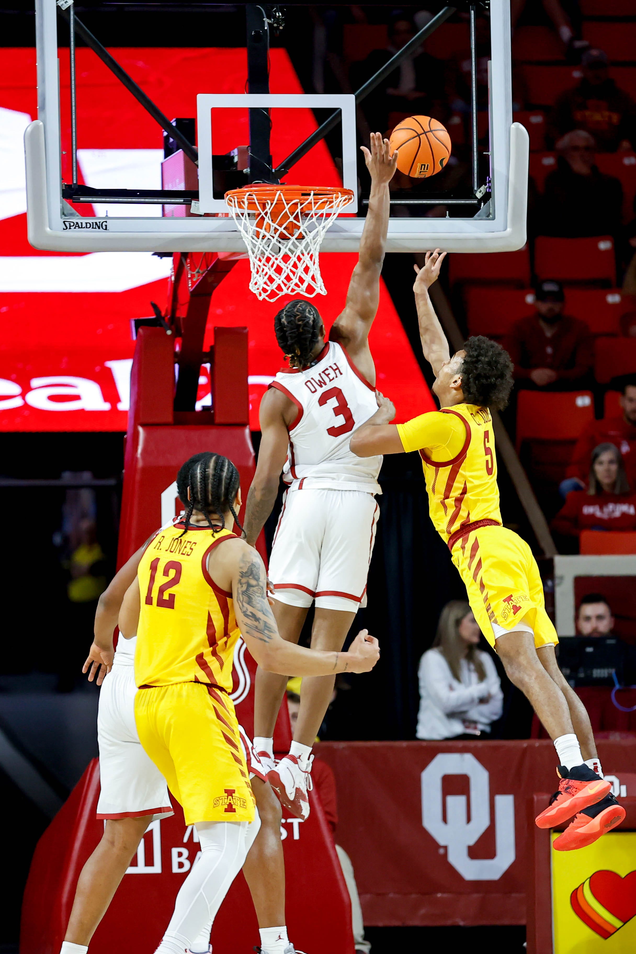 Oklahoma guard Otega Oweh (3) blocks a layup attempt by Iowa State guard Curtis Jones (5) in the first half during an NCAA basketball game between University of Oklahoma (OU) and Iowa State at the Lloyd Noble Center in Norman, Okla., on Saturday, Jan. 6, 2024.