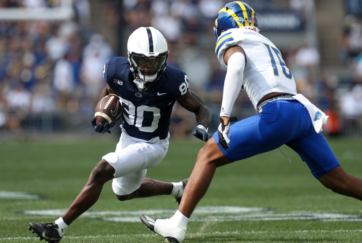 Sep 9, 2023; University Park, Pennsylvania, USA; Penn State Nittany Lions wide receiver Cristian Driver (80) runs with the ball while trying to avoid a tackle during the fourth quarter against the Delaware Fightin' Blue Hens at Beaver Stadium. Penn State defeated Delaware 63-7.