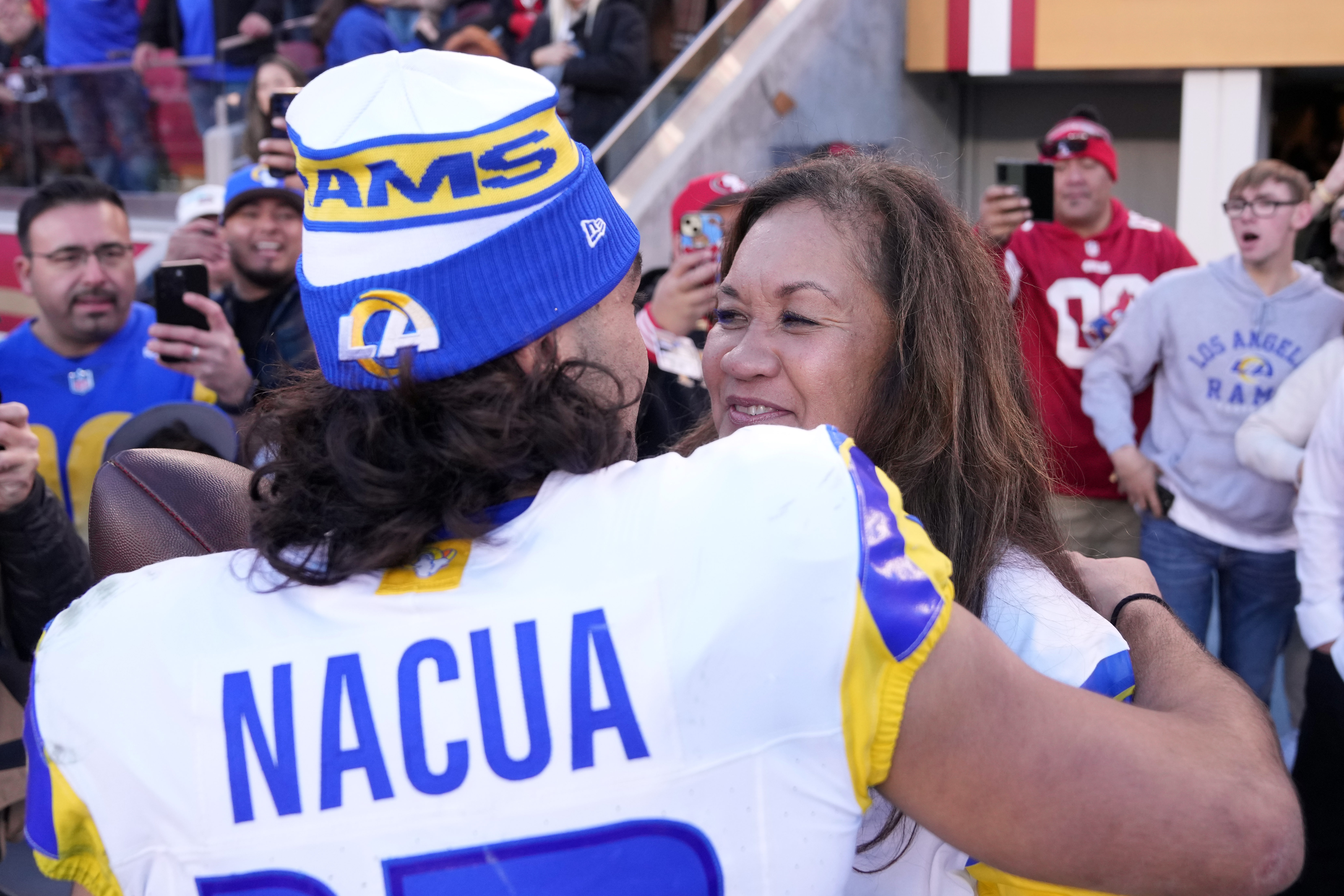 Jan 7, 2024; Santa Clara, California, USA; Los Angeles Rams wide receiver Puka Nacua (left) talks with his mother Penina (right) after defeating the San Francisco 49ers at Levi's Stadium.