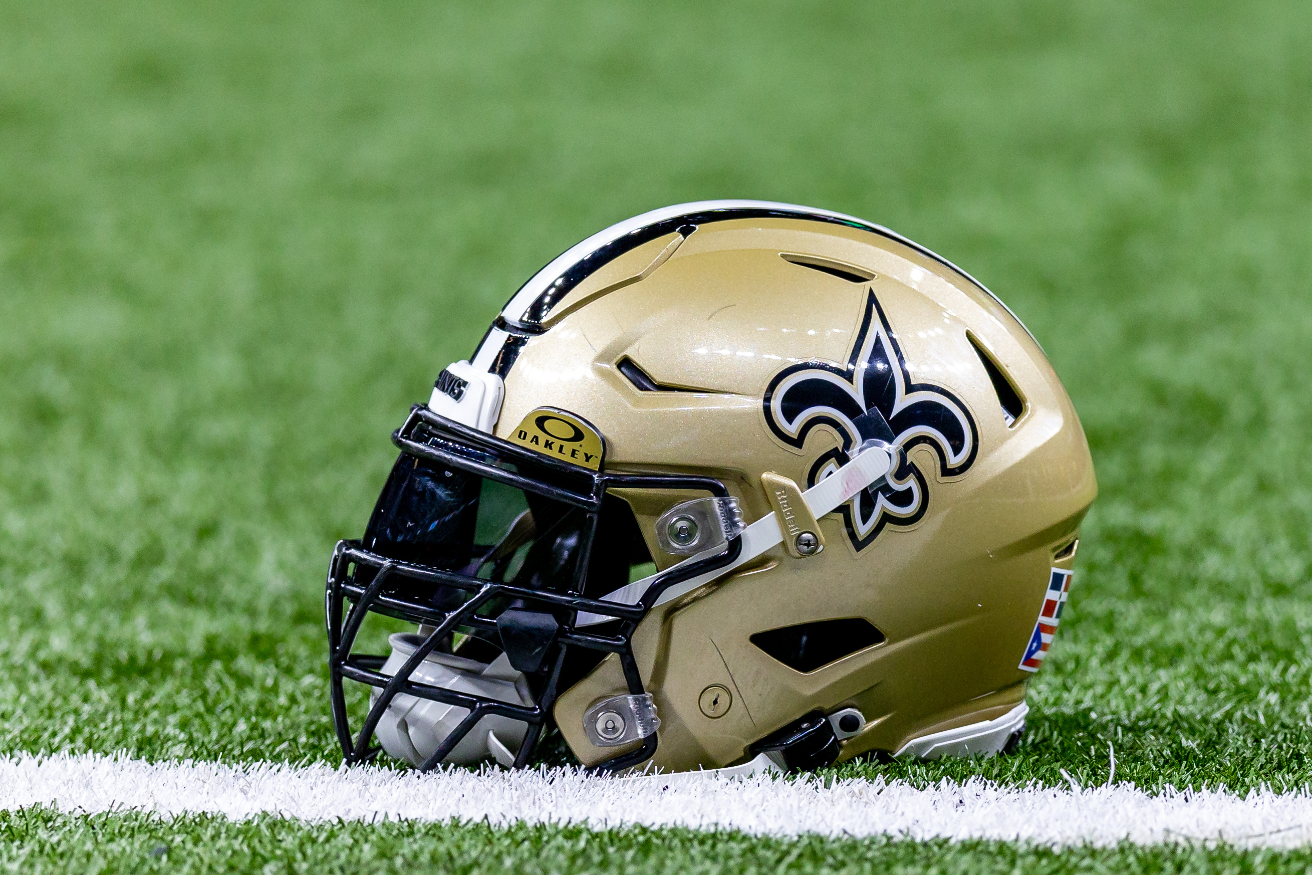 Detailed view of the New Orleans Saints helmet during warmups against the Atlanta Falcons at Caesars Superdome.
