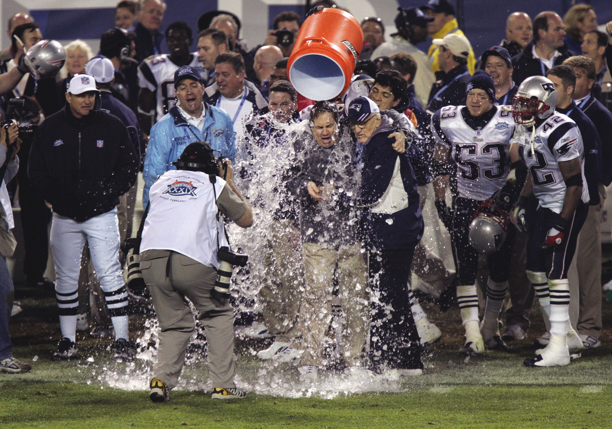 Bill Belichick and his dad receive a Gatorade bath as the Patriots beat the Eagles in Super Bowl XXXIX.
