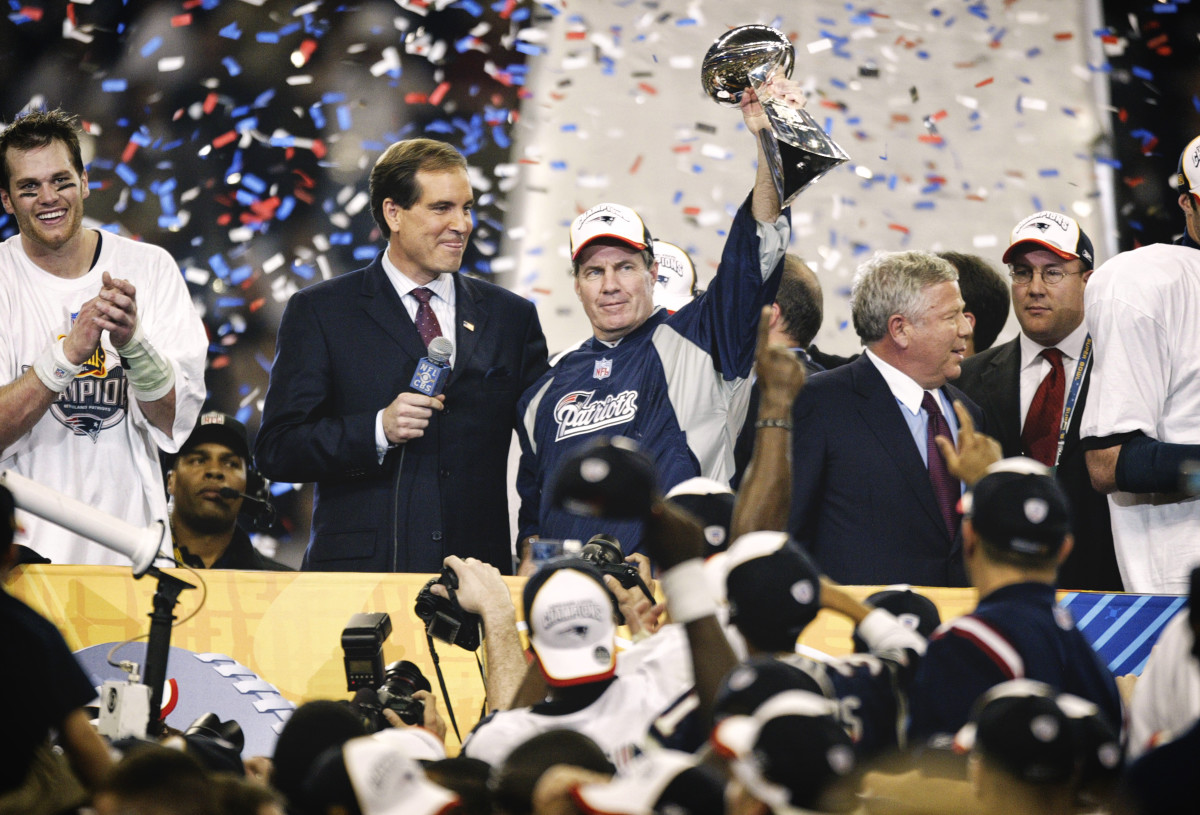 Bill Belichick hoists the Lombardi Trophy after Super Bowl XXXVIII.