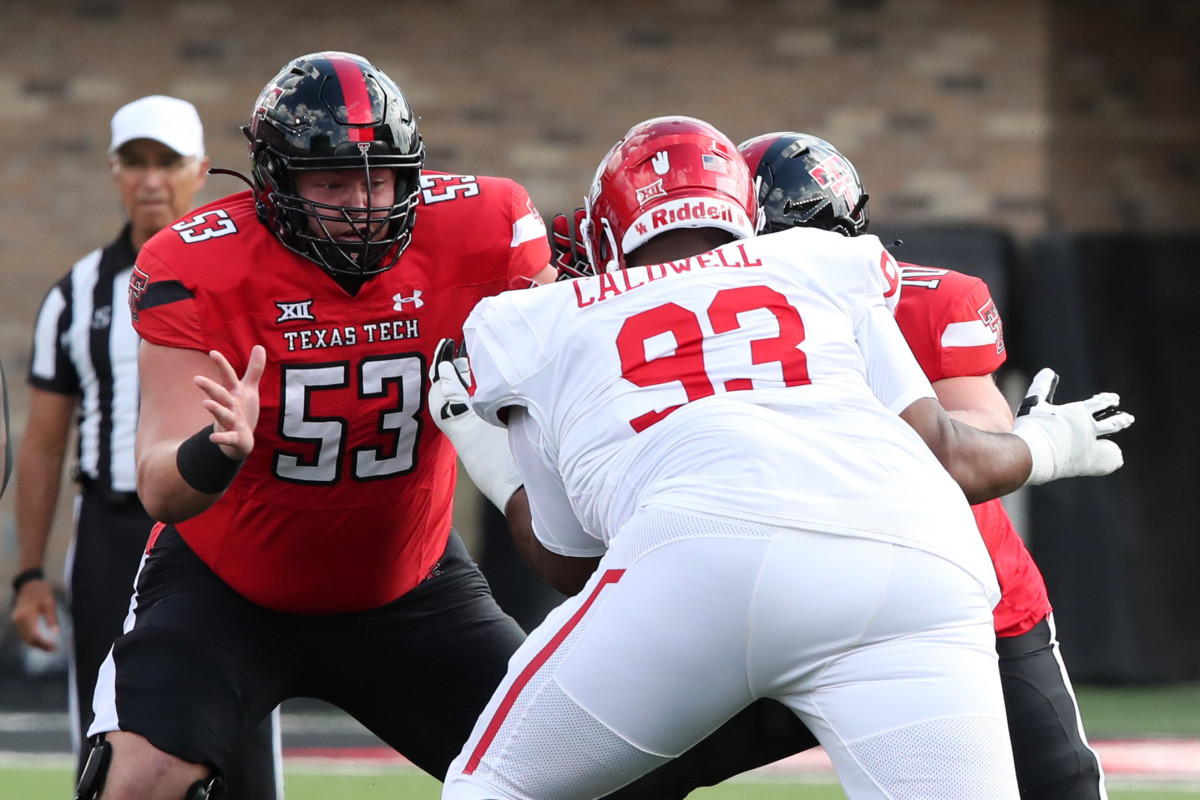 Sep 30, 2023; Lubbock, Texas, USA; Texas Tech Red Raiders offensive center Rusty Staats (53) blocks Houston Cougars defensive tackle Jamaree Caldwell (93) in the second half at Jones AT&T Stadium and Cody Campbell Field. Mandatory Credit: Michael C. Johnson-USA TODAY Sports
