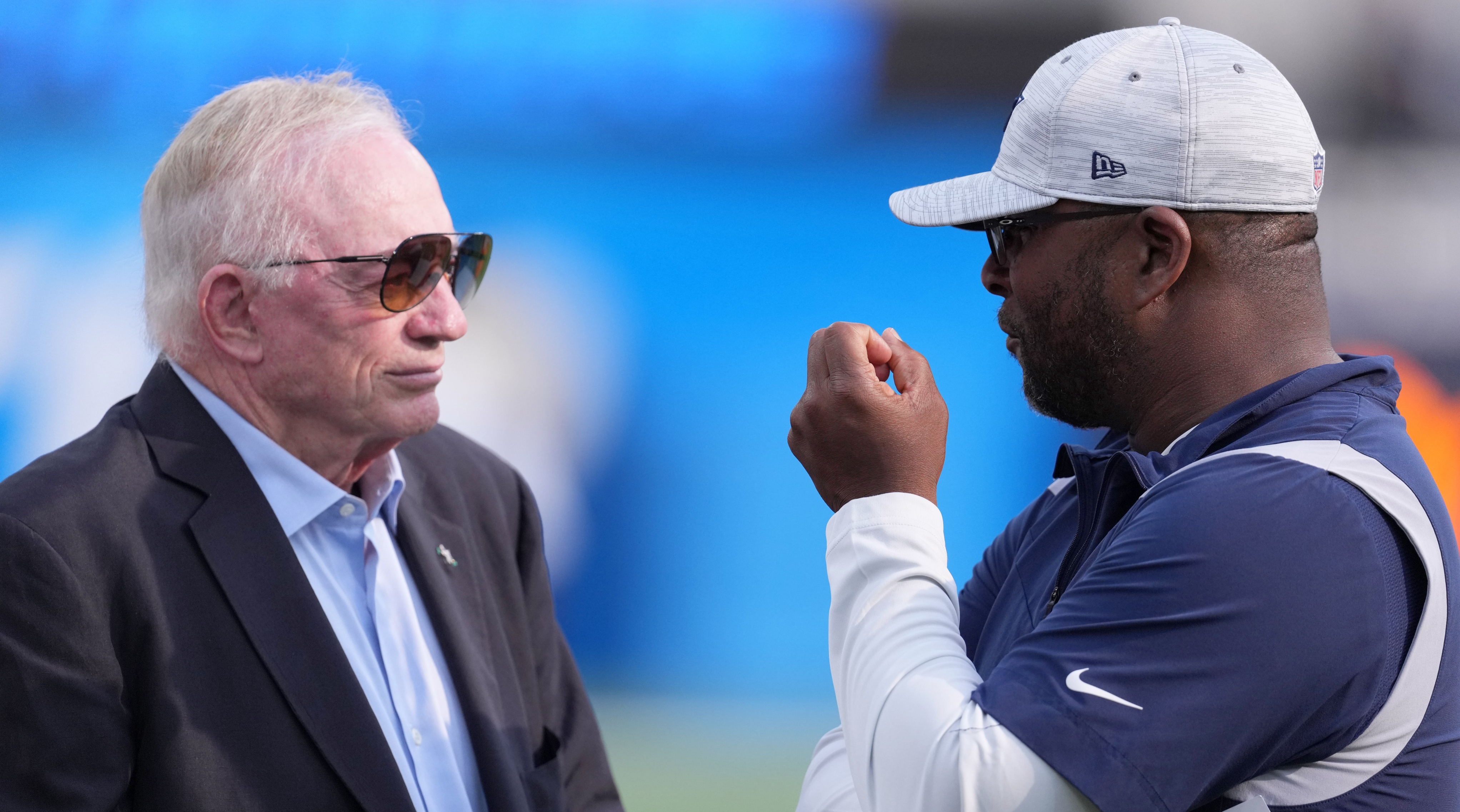 Dallas Cowboys owner Jerry Jones (left) talks with vice president of player personnel Will McClay before a preseason game against the Los Angeles Chargers