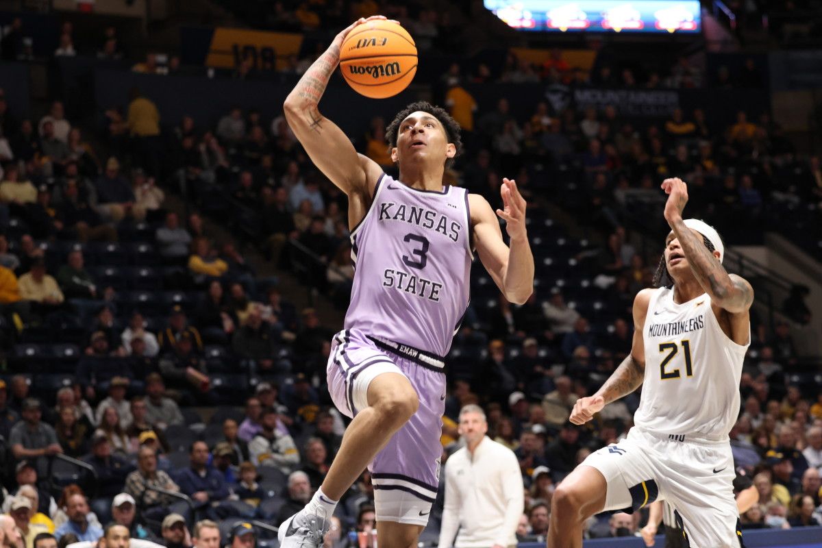 Kansas State guard Dorian Finister goes in for the slam dunk following a Mountaineer turnover.