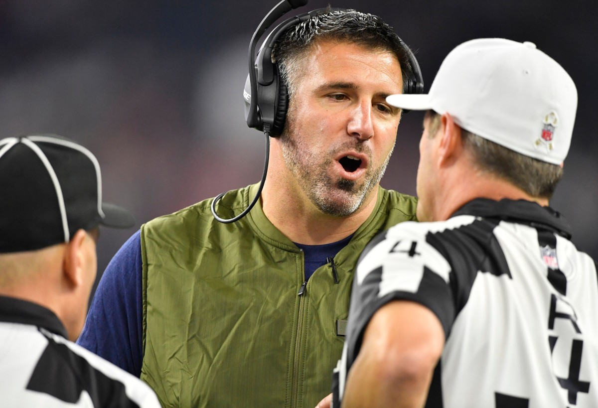Titans head coach Mike Vrabel talks to referees after losing his fifth challenge at NRG Stadium Monday, Nov. 26, 2018, in Houston, Texas.