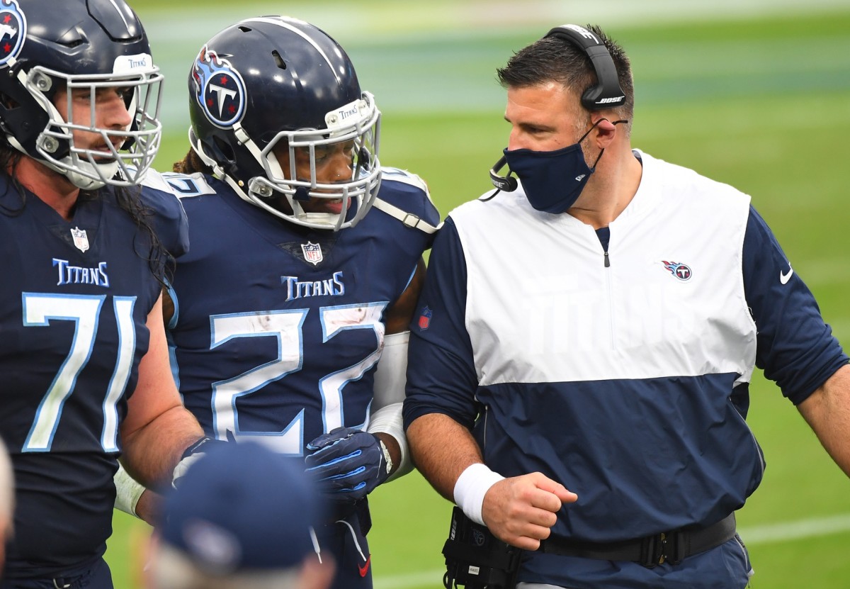 Oct 18, 2020; Nashville, Tennessee, USA; Tennessee Titans running back Derrick Henry (22) is congratulated by Tennessee Titans head coach Mike Vrabel after a touchdown run during the second half against the Houston Texans at Nissan Stadium.