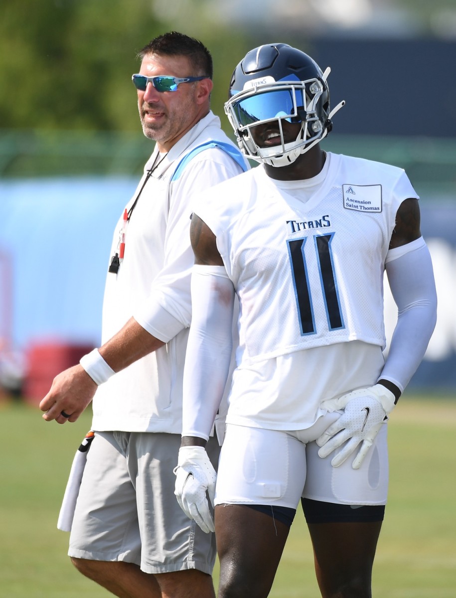 Tennessee Titans head coach Mike Vrabel talks with Tennessee Titans wide receiver A.J. Brown (11) during training camp at Saint Thomas Sports Park in 2021.