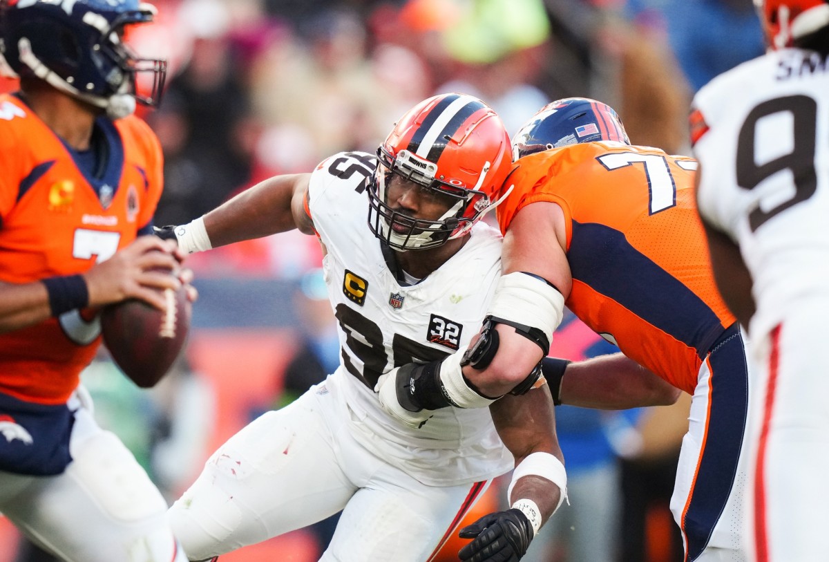Nov 26, 2023; Denver, Colorado, USA; Cleveland Browns defensive end Myles Garrett (95) drives past Denver Broncos offensive tackle Garett Bolles (72)in the first half at Empower Field at Mile High. Mandatory Credit: Ron Chenoy-USA TODAY Sports  