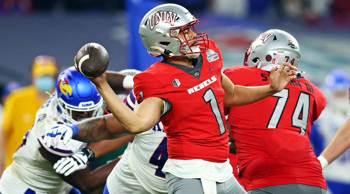 UNLV quarterback Jayden Maiava (1) throws a pass during the second half against Kansas in the Guaranteed Rate Bowl at Chase Field.