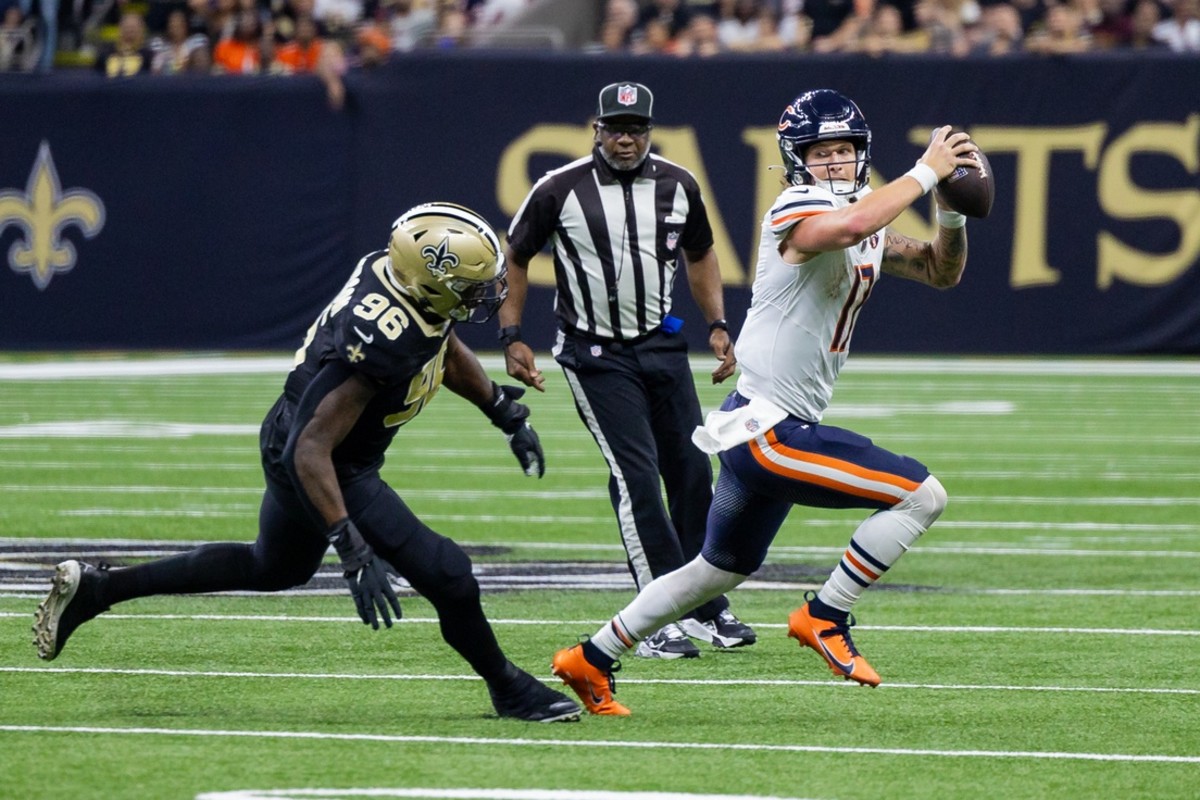 Chicago Bears quarterback Tyson Bagent (17) is chased down by New Orleans Saints defensive end Carl Granderson (96). Mandatory Credit: Stephen Lew-USA TODAY
