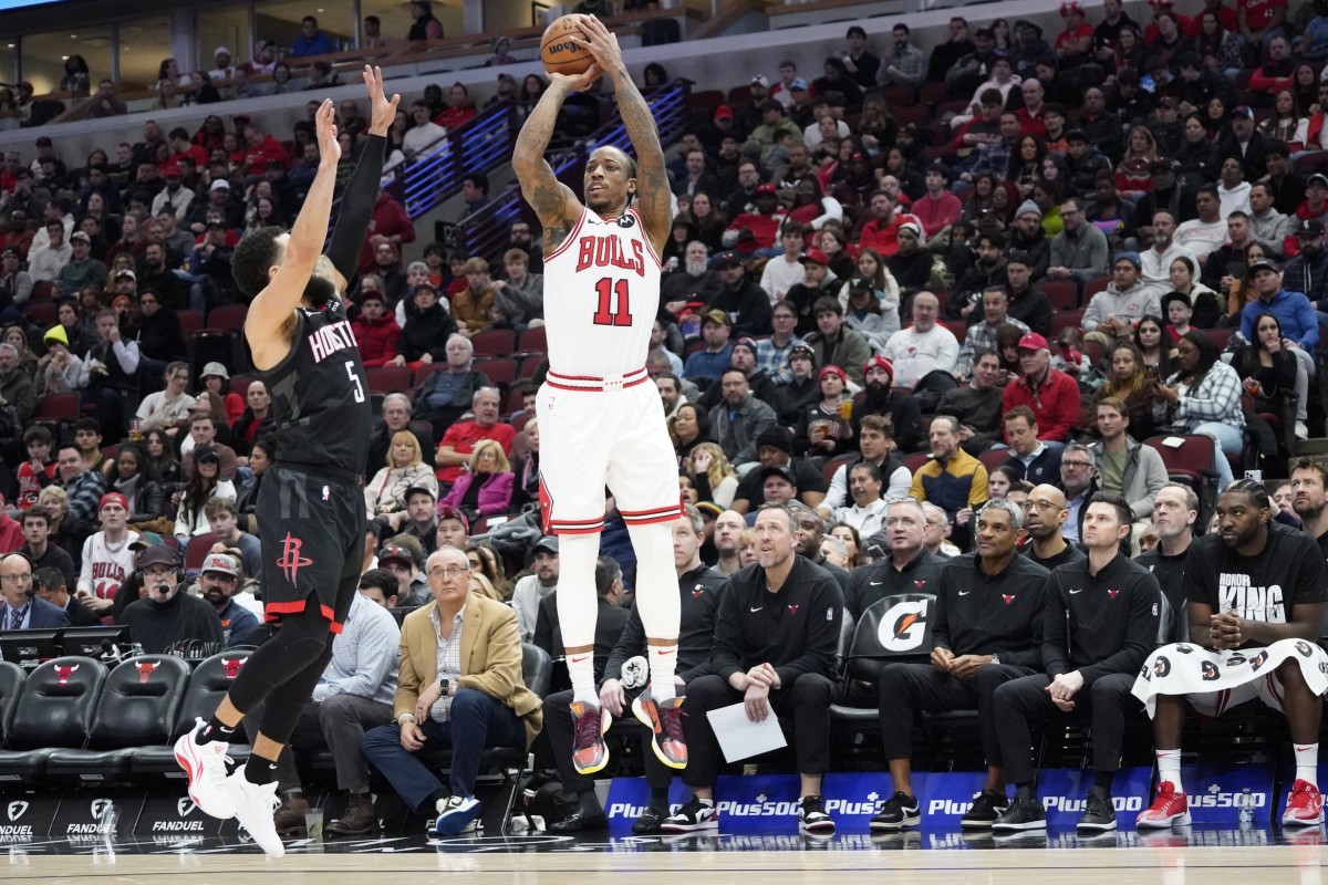 Chicago Bulls forward DeMar DeRozan (11) shoots over Houston Rockets guard Fred VanVleet (5) during the second half at United Center.