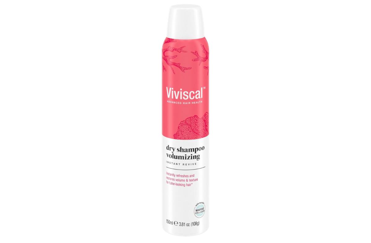 A coral and white bottle of Viviscal Volumizing Dry Shampoo against a white background.
