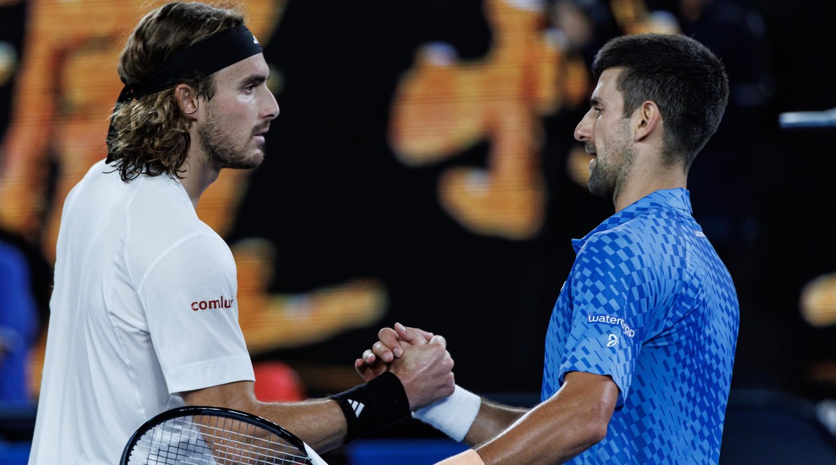 Novak Djokovic shakes hands with Stefanos Tsitsipas.