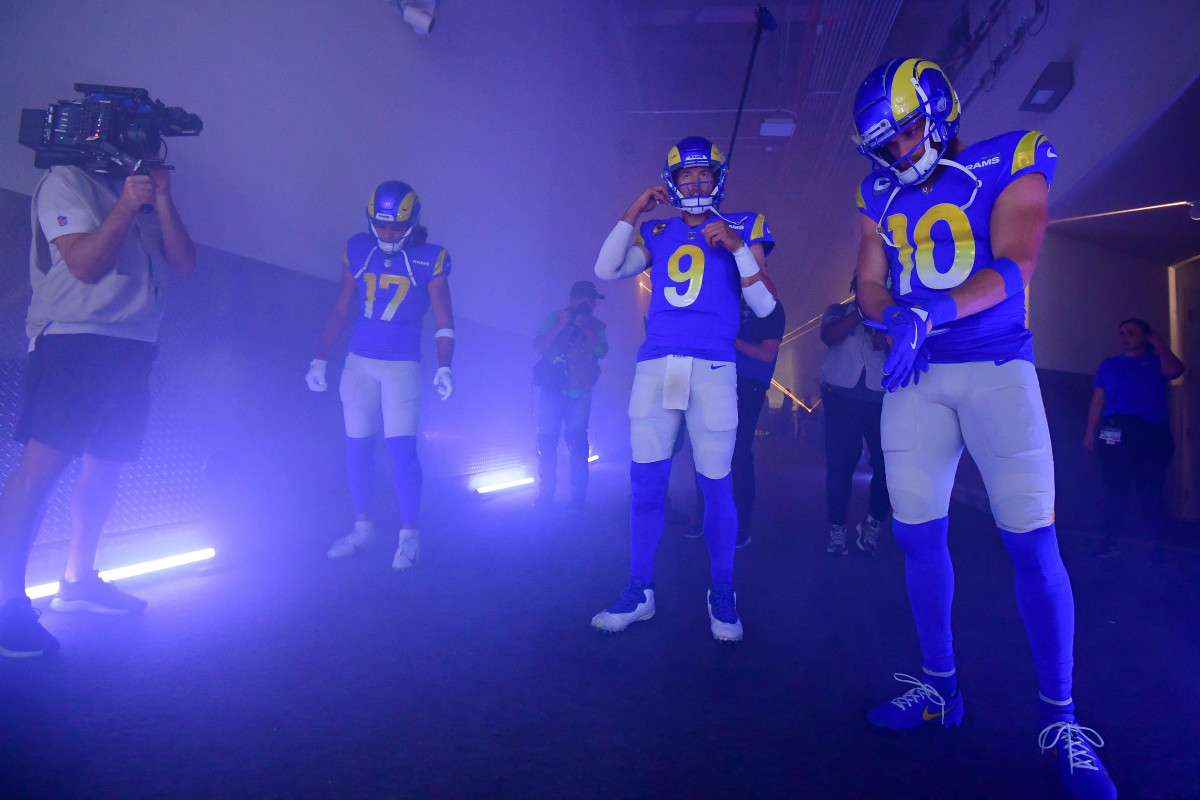 Puka Nacua, Matthew Stafford and Cooper Kupp standing in the tunnel before taking the field for a game.